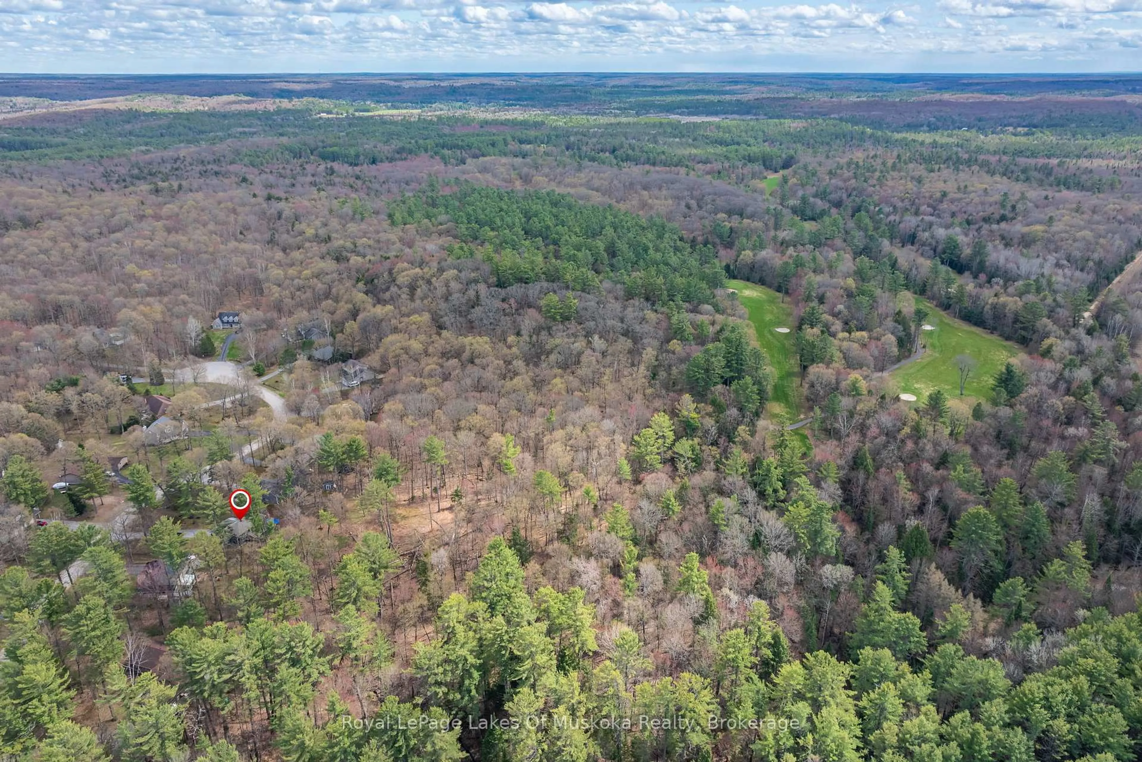 A pic from outside/outdoor area/front of a property/back of a property/a pic from drone, forest/trees view for 84 Clarke Cres, Huntsville Ontario P0B 1L0