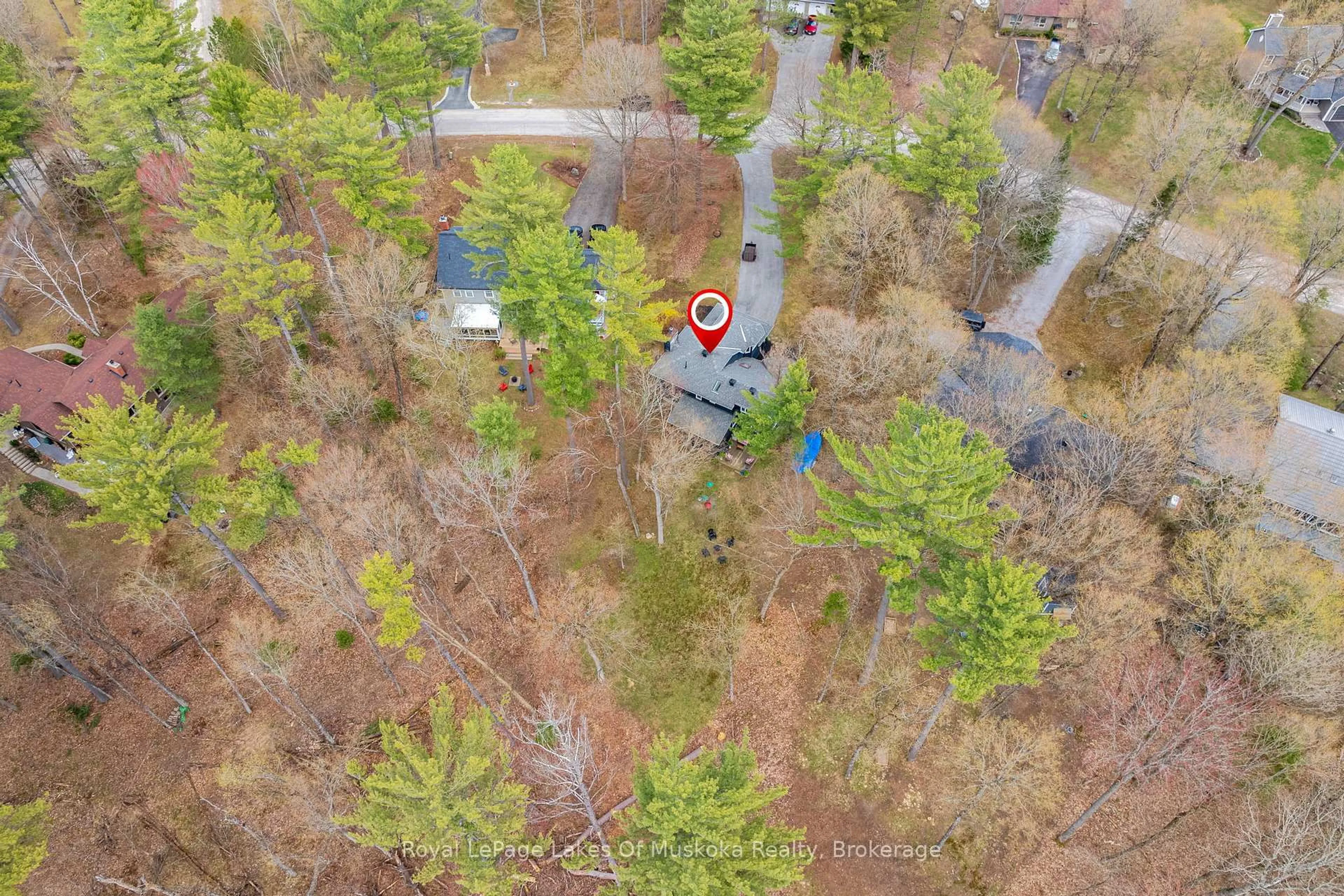 A pic from outside/outdoor area/front of a property/back of a property/a pic from drone, forest/trees view for 84 Clarke Cres, Huntsville Ontario P0B 1L0