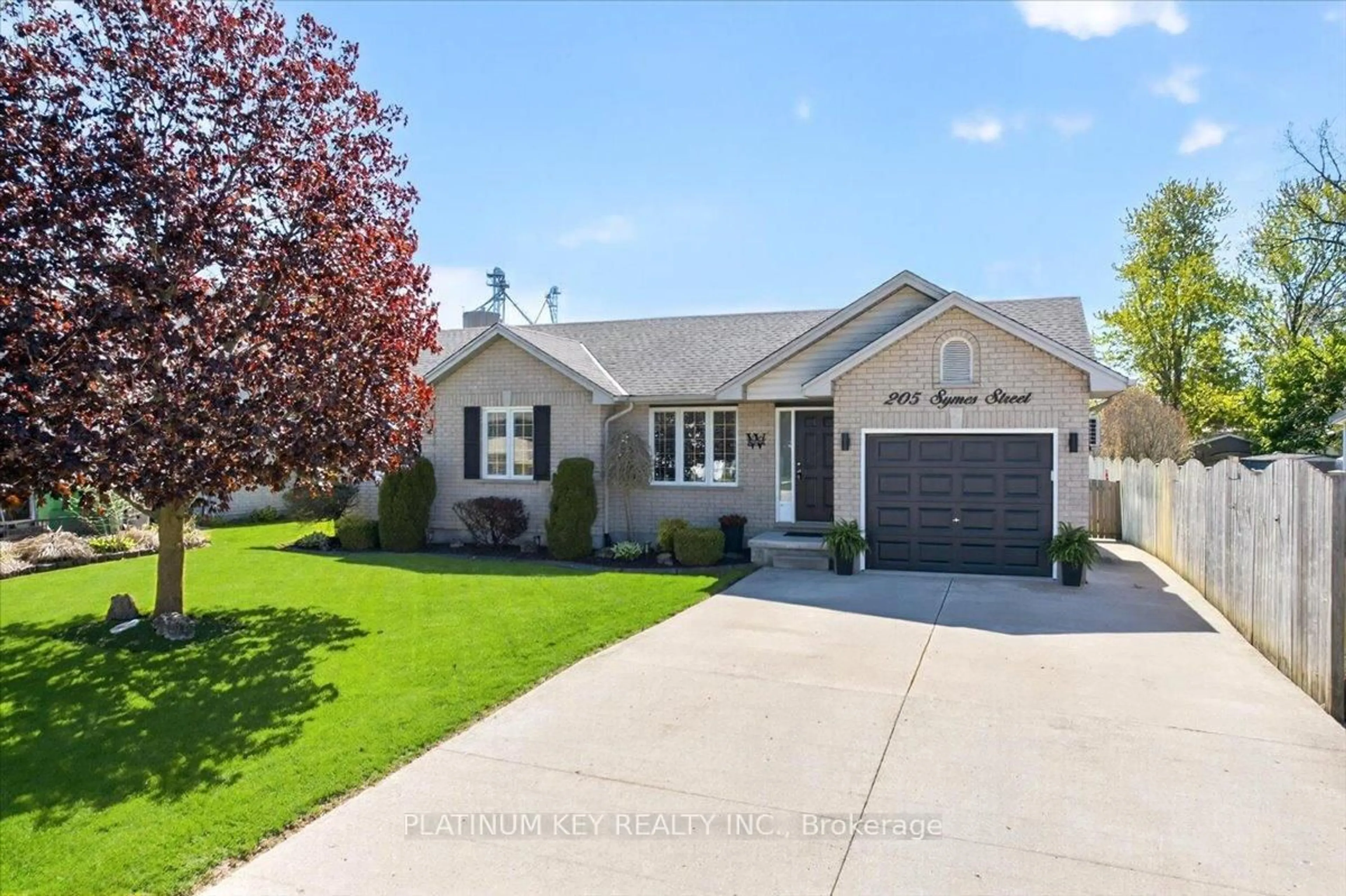 Home with vinyl exterior material, street for 205 Symes St, Southwest Middlesex Ontario N0L 1M0
