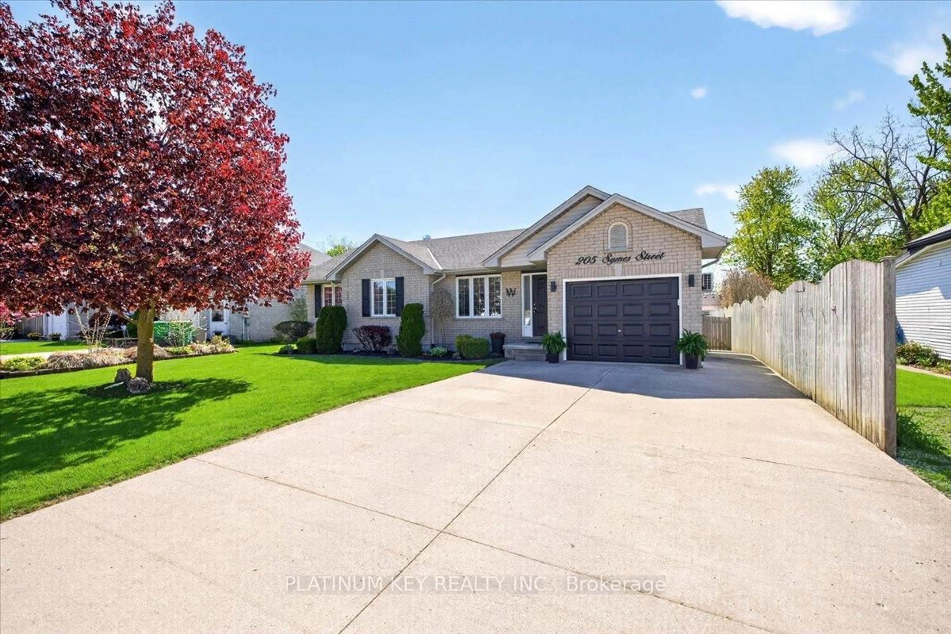 Home with vinyl exterior material, street for 205 Symes St, Southwest Middlesex Ontario N0L 1M0