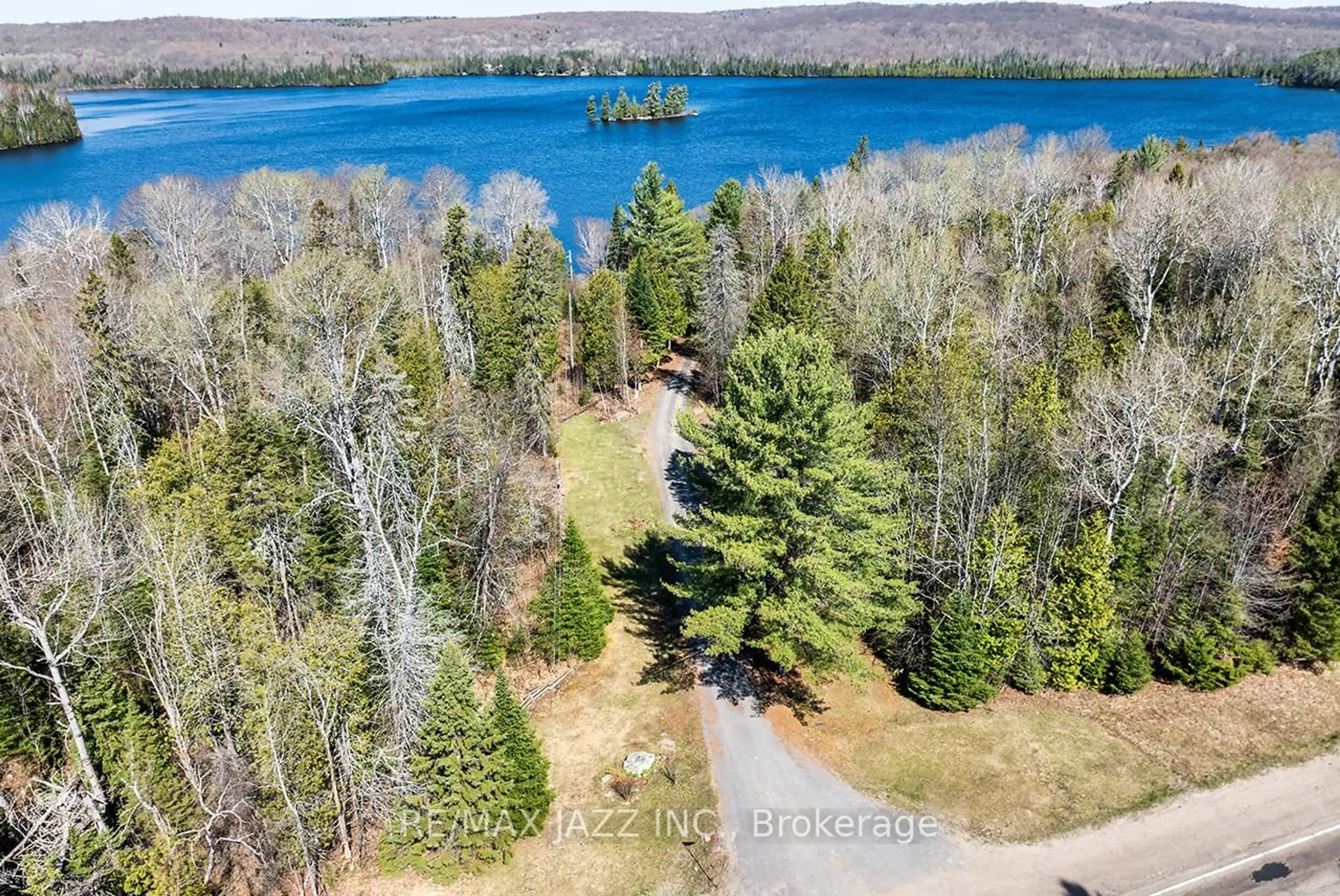 A pic from outside/outdoor area/front of a property/back of a property/a pic from drone, water/lake/river/ocean view for 37343 Highway 62, Maynooth Ontario K0L 2S0
