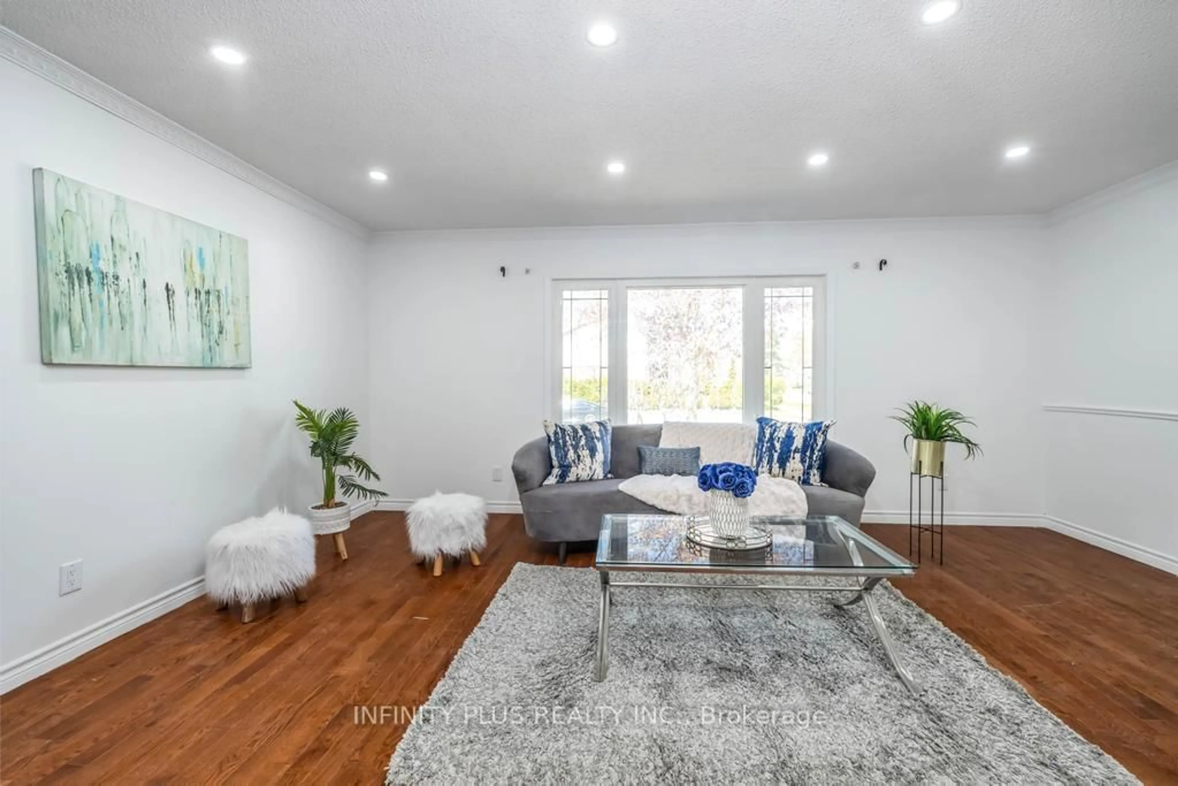 Living room with furniture, wood/laminate floor for 180 St Jerome Cres, Kitchener Ontario N2C 2L2