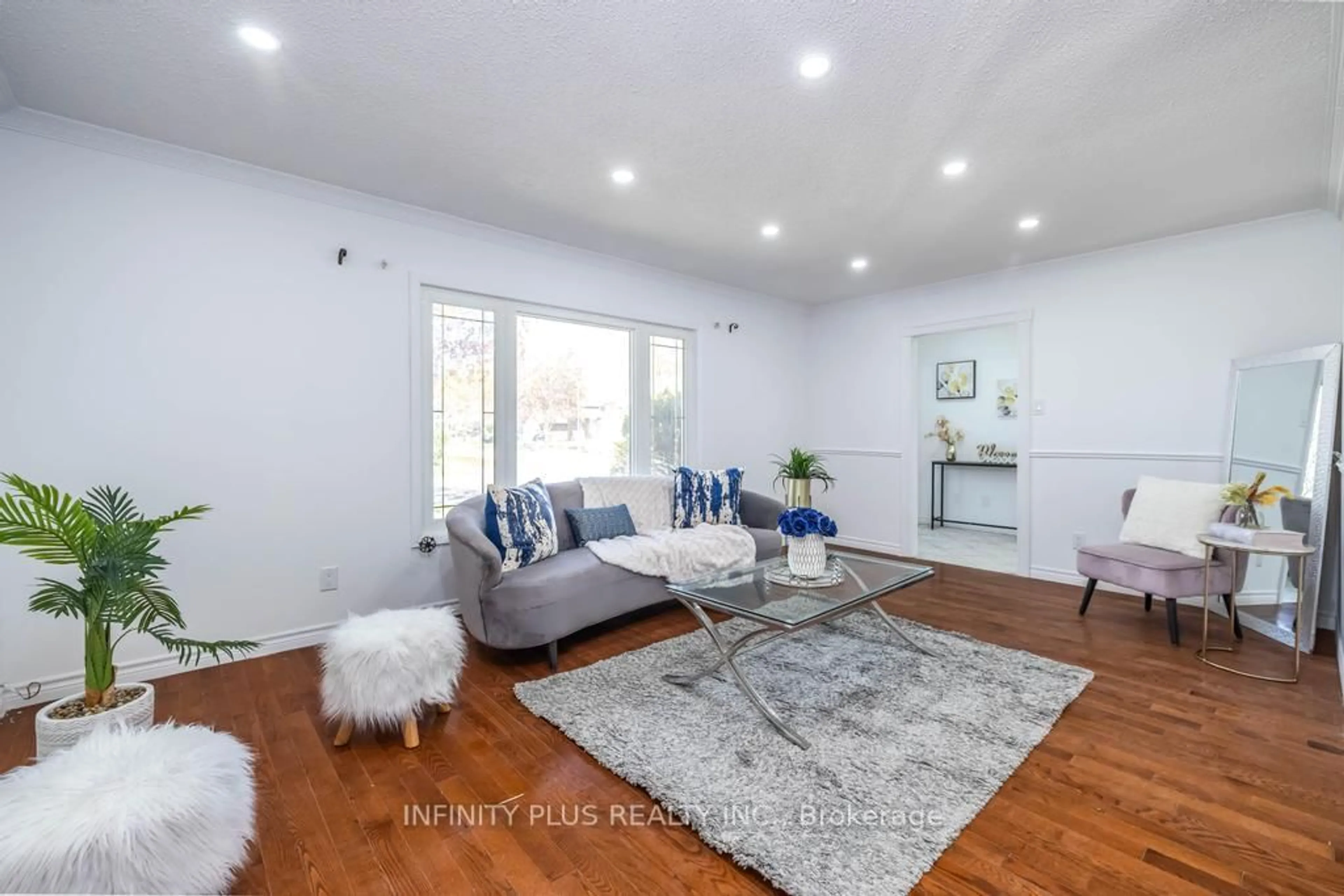 Living room with furniture, wood/laminate floor for 180 St Jerome Cres, Kitchener Ontario N2C 2L2