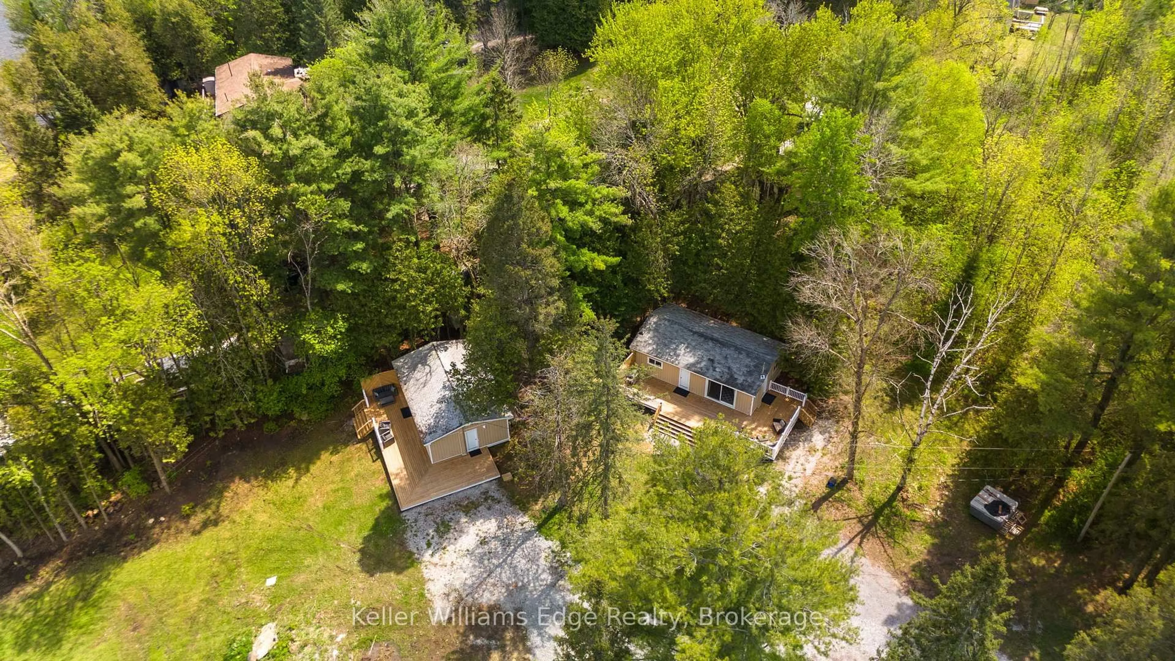 A pic from outside/outdoor area/front of a property/back of a property/a pic from drone, forest/trees view for 7296 Hwy 35, Kawartha Lakes Ontario K0M 1K0