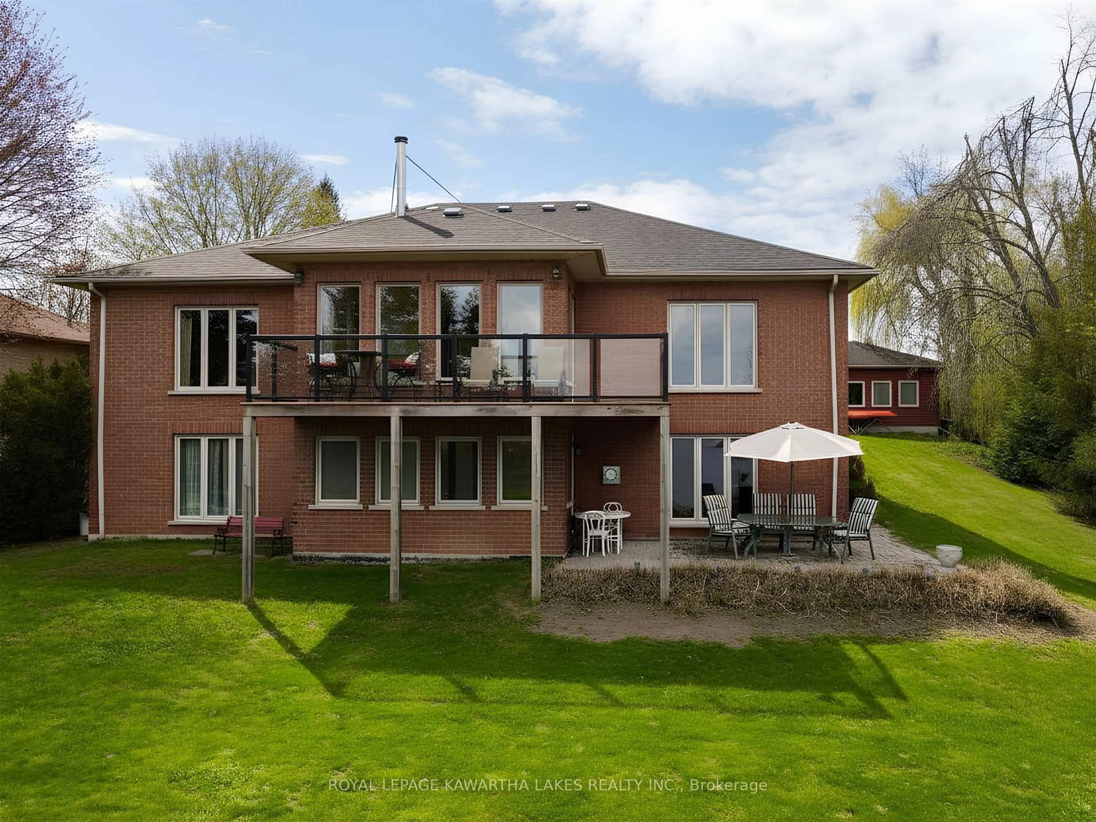 A pic from outside/outdoor area/front of a property/back of a property/a pic from drone, water/lake/river/ocean view for 21 Emerald St, Kawartha Lakes Ontario K9V 4R6