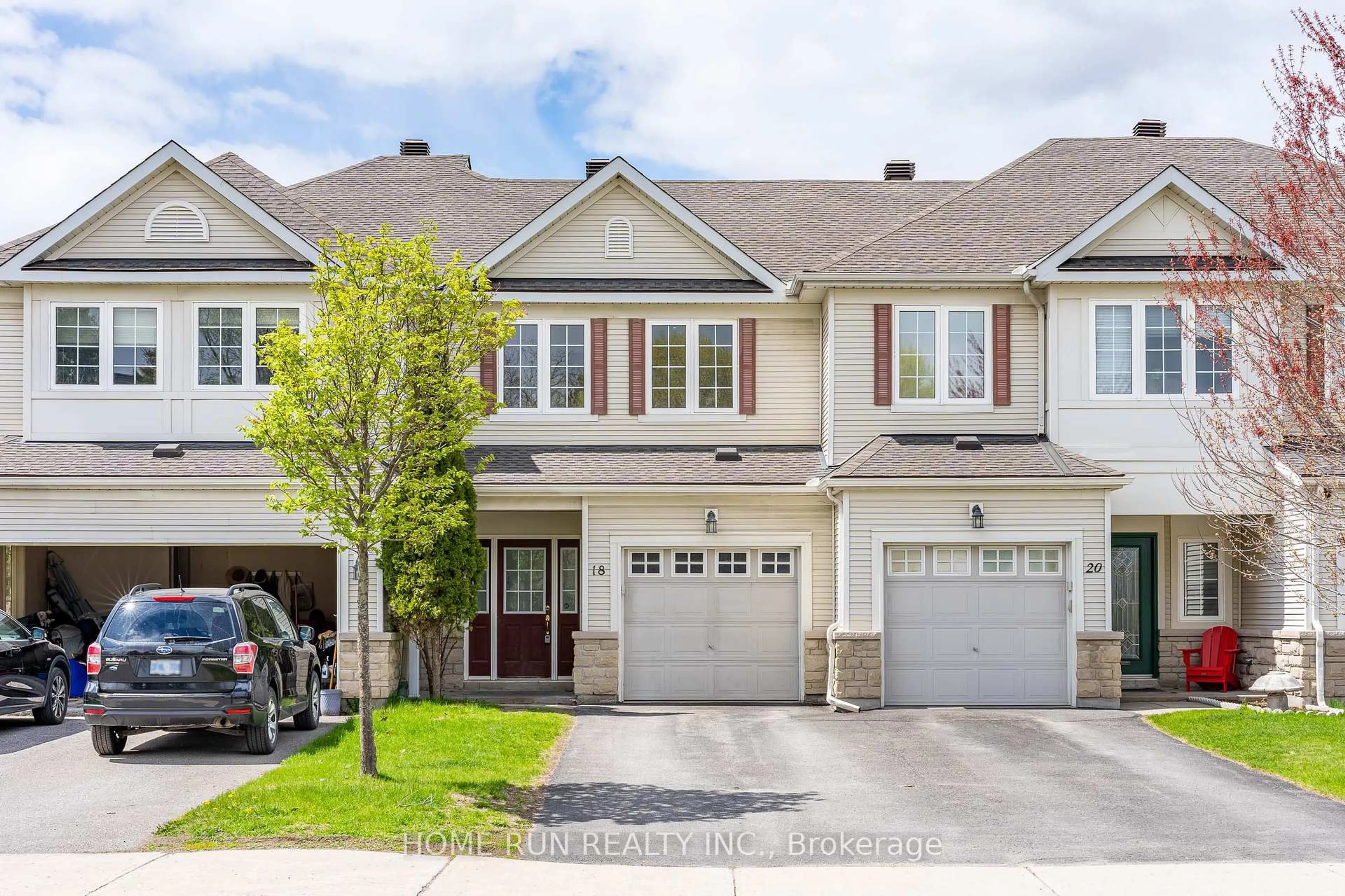 Home with vinyl exterior material, street for 18 Riverstone Dr, Ottawa Ontario K2J 4X7