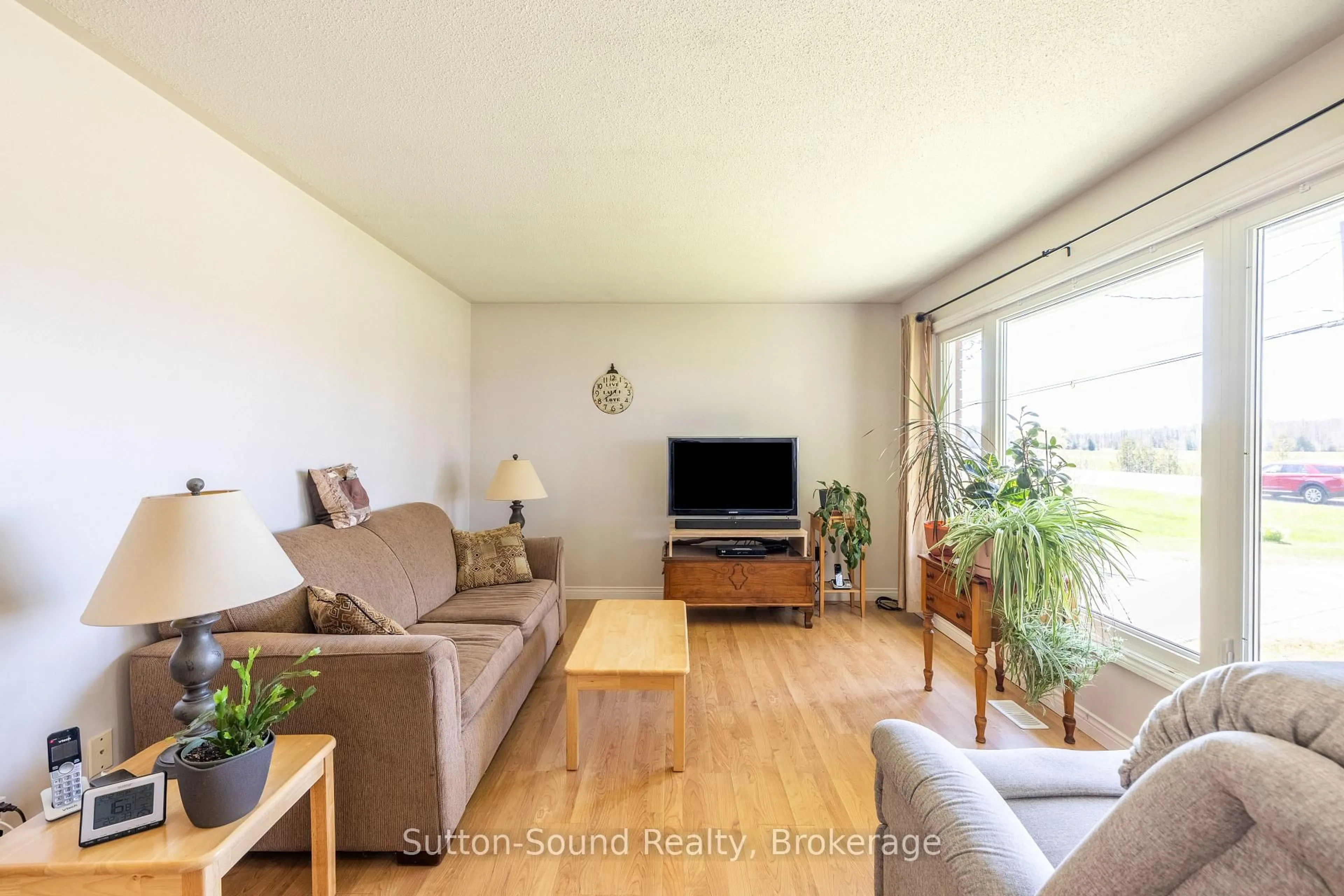 Living room with furniture, wood/laminate floor for 19589 Highway 6 Highway, South Bruce Peninsula Ontario N0H 2T0