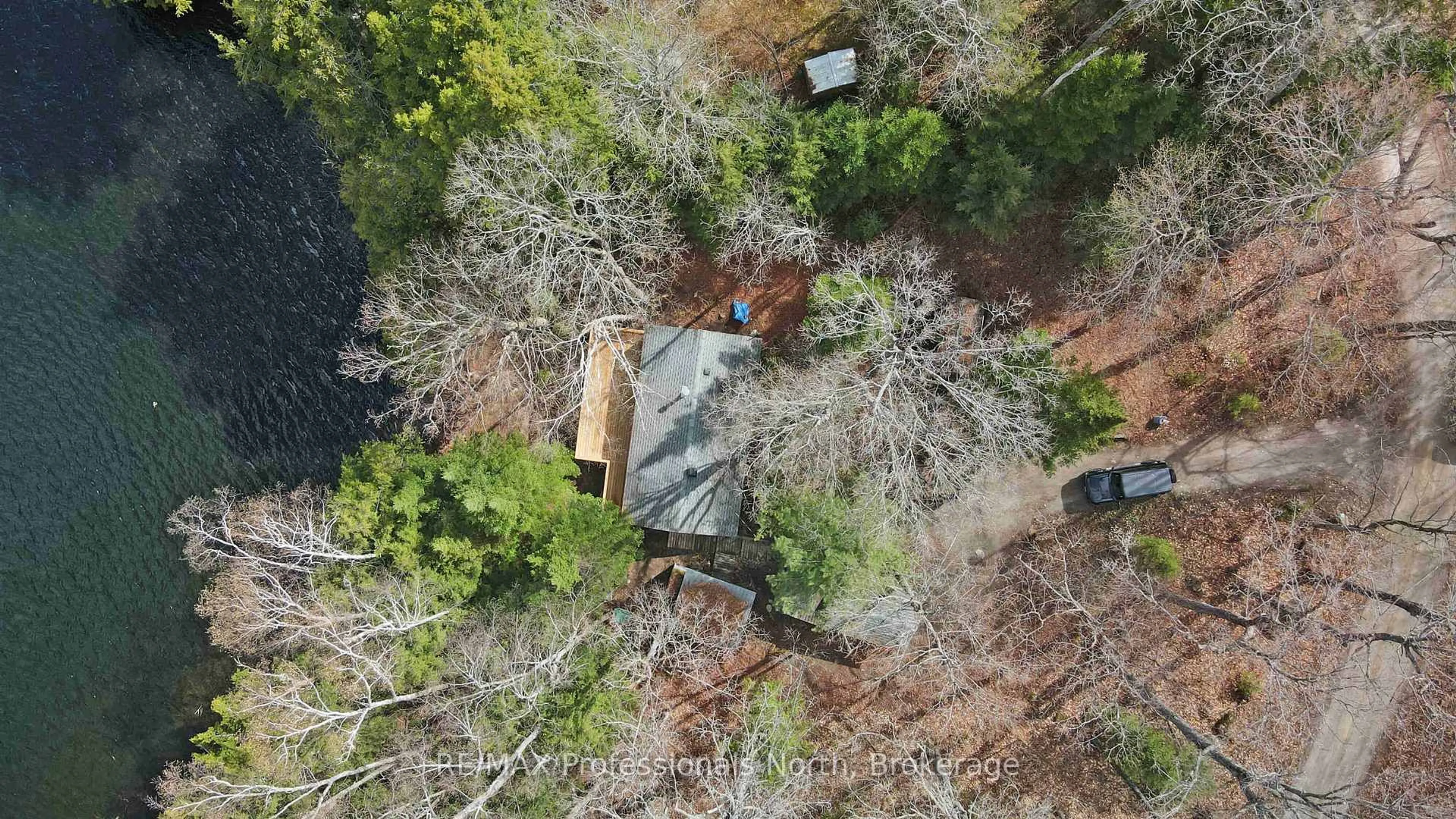 A pic from outside/outdoor area/front of a property/back of a property/a pic from drone, forest/trees view for 1396 Betula Cres, Dysart et al Ontario K0L 1M1