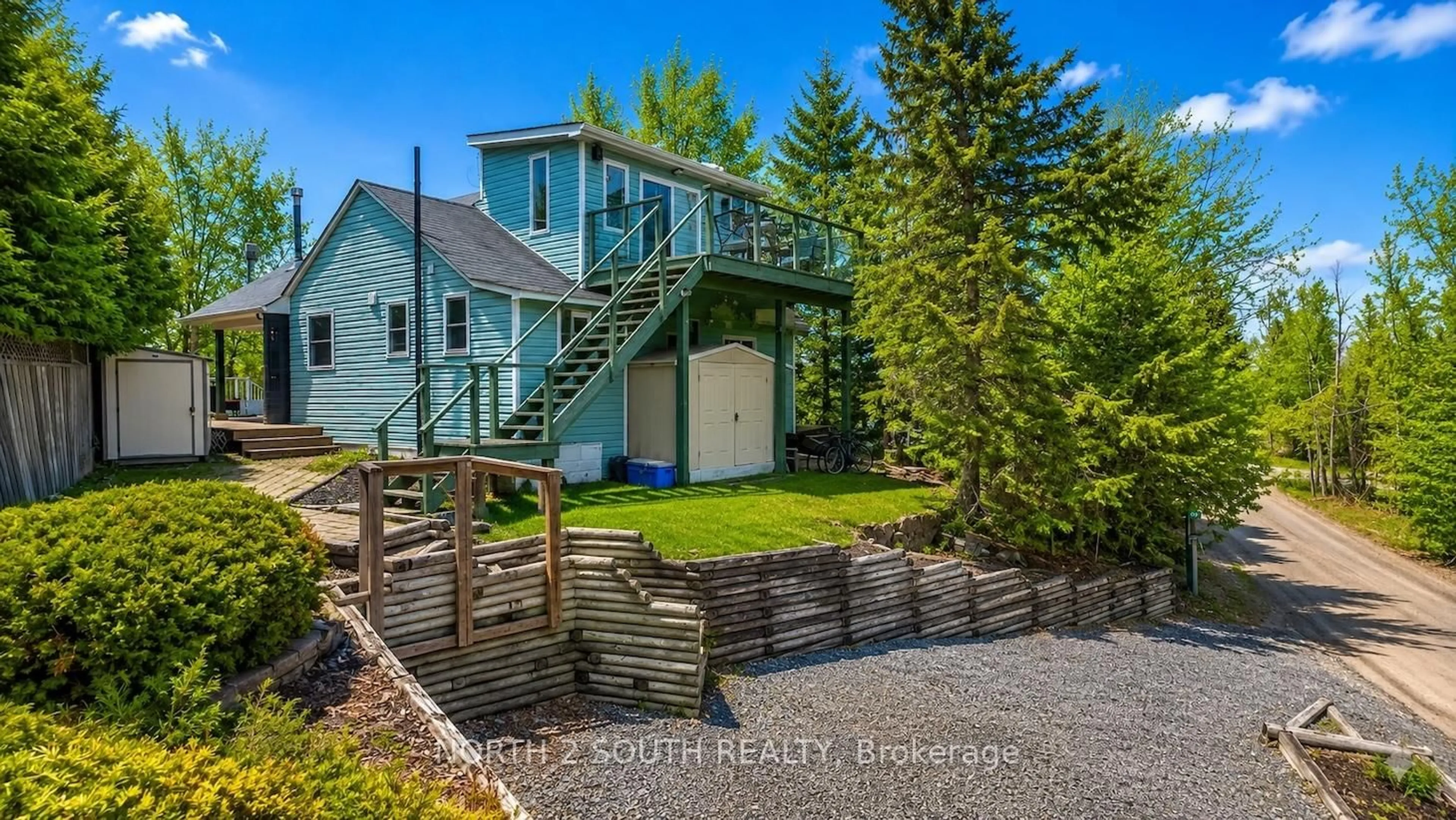 A pic from outside/outdoor area/front of a property/back of a property/a pic from drone, unknown for 123 Fells Point Rd, Kawartha Lakes Ontario K0M 1N0