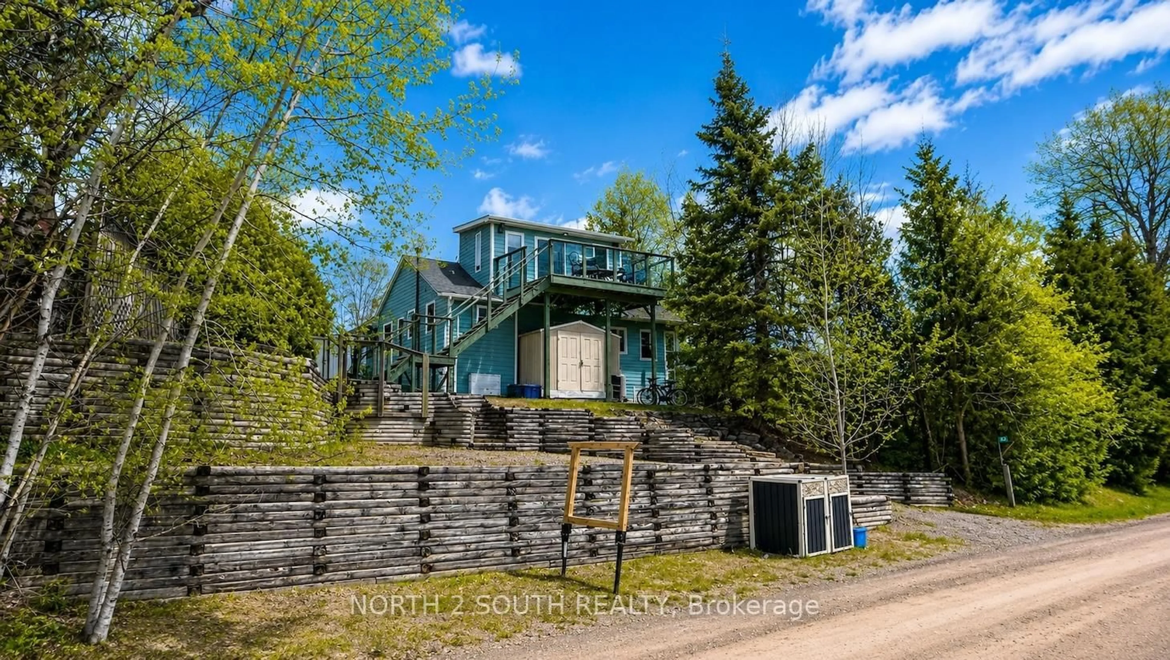 A pic from outside/outdoor area/front of a property/back of a property/a pic from drone, unknown for 123 Fells Point Rd, Kawartha Lakes Ontario K0M 1N0