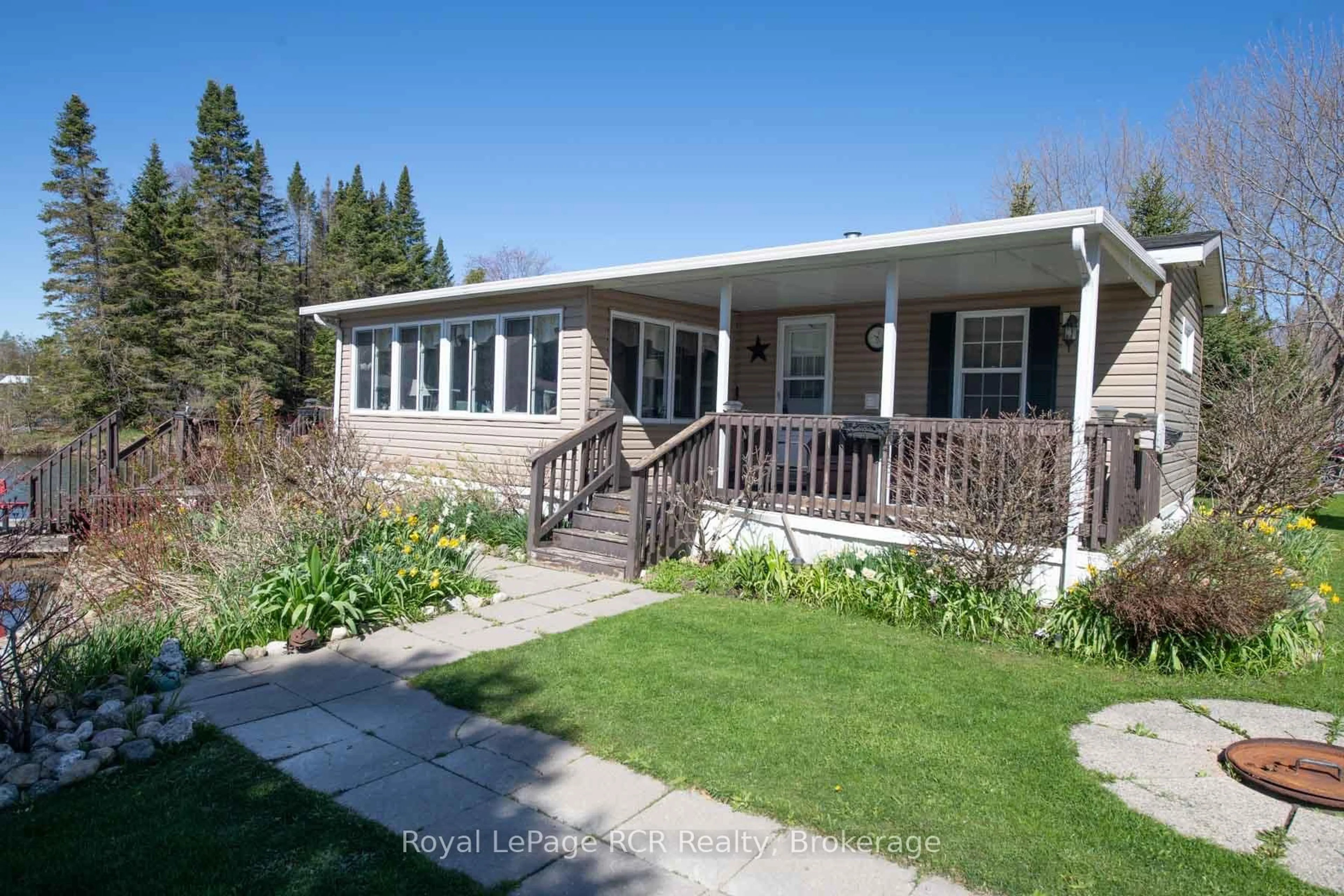 Home with vinyl exterior material, street for 61 LAKESIDE St, Wellington North Ontario N0G 2L0