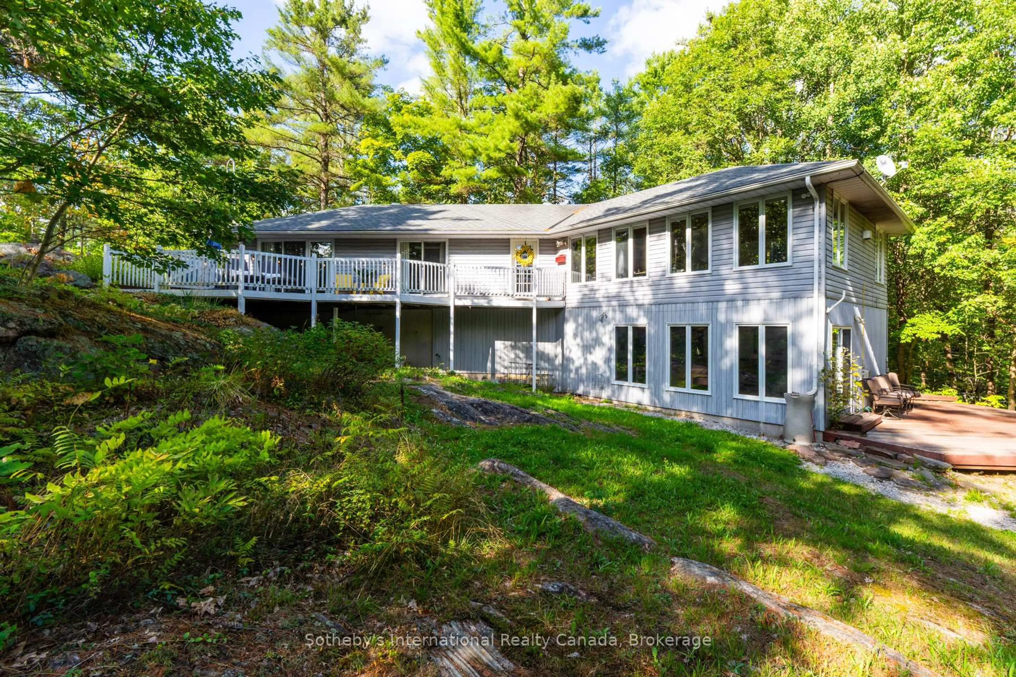 A pic from outside/outdoor area/front of a property/back of a property/a pic from drone, water/lake/river/ocean view for 1060 North Kahshe Lake Rd, Gravenhurst Ontario P0E 1G0