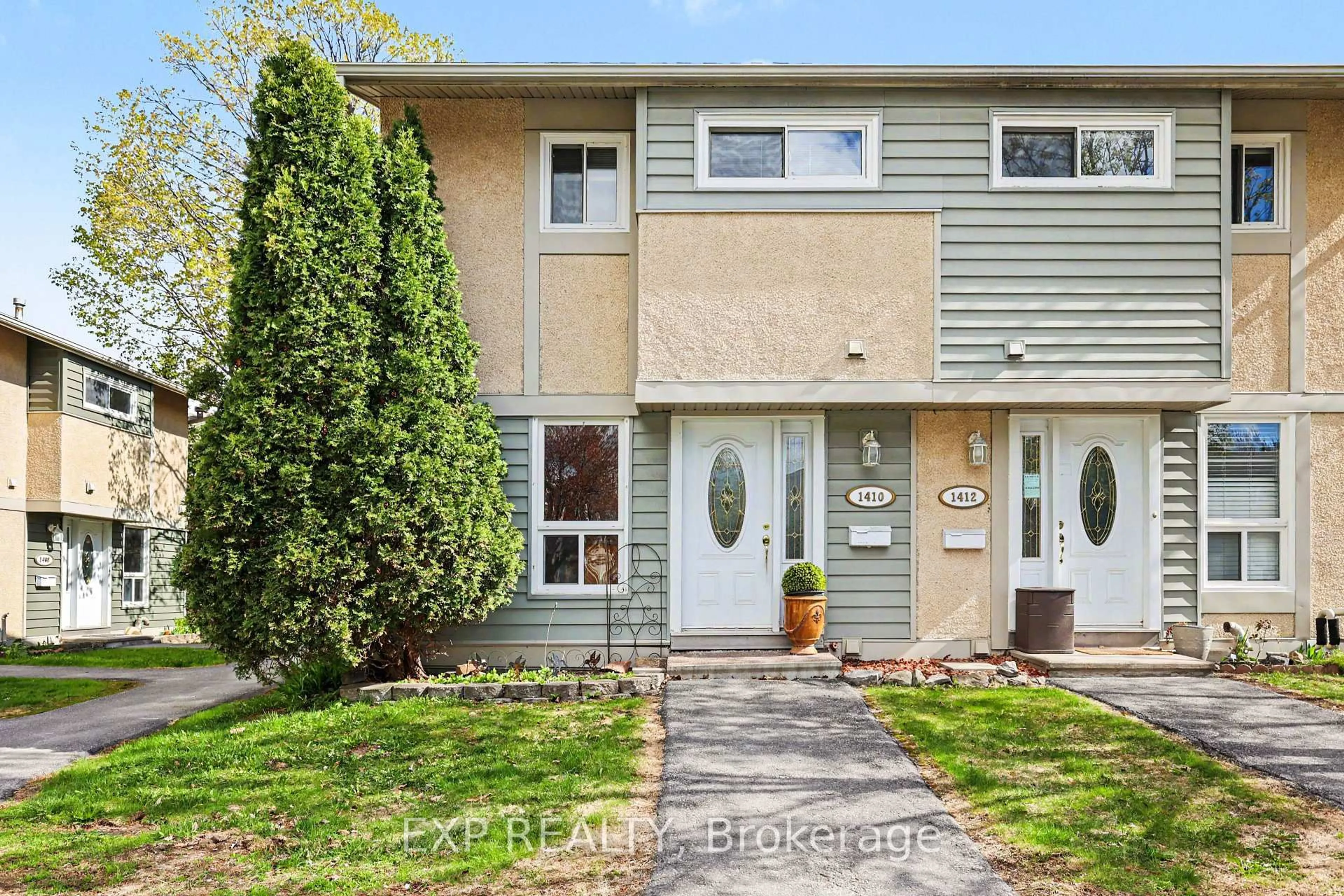 Home with vinyl exterior material, street for 1410 Ballard Crt, Ottawa Ontario K1B 4Z2
