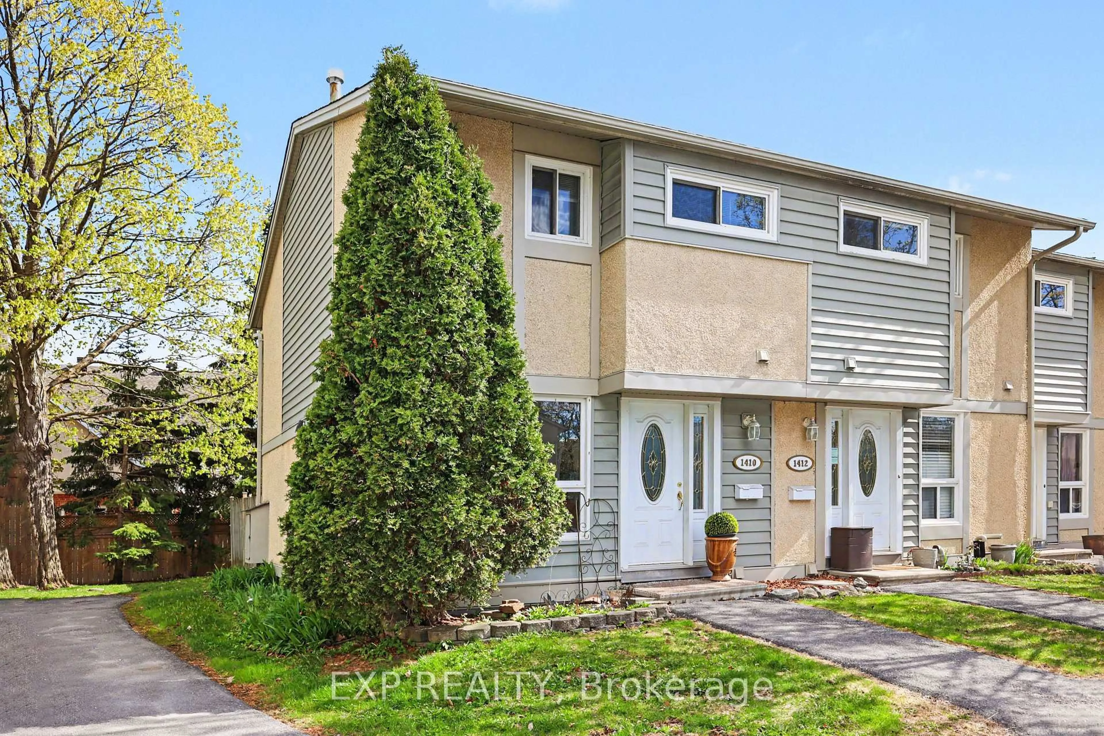 Home with vinyl exterior material, street for 1410 Ballard Crt, Ottawa Ontario K1B 4Z2