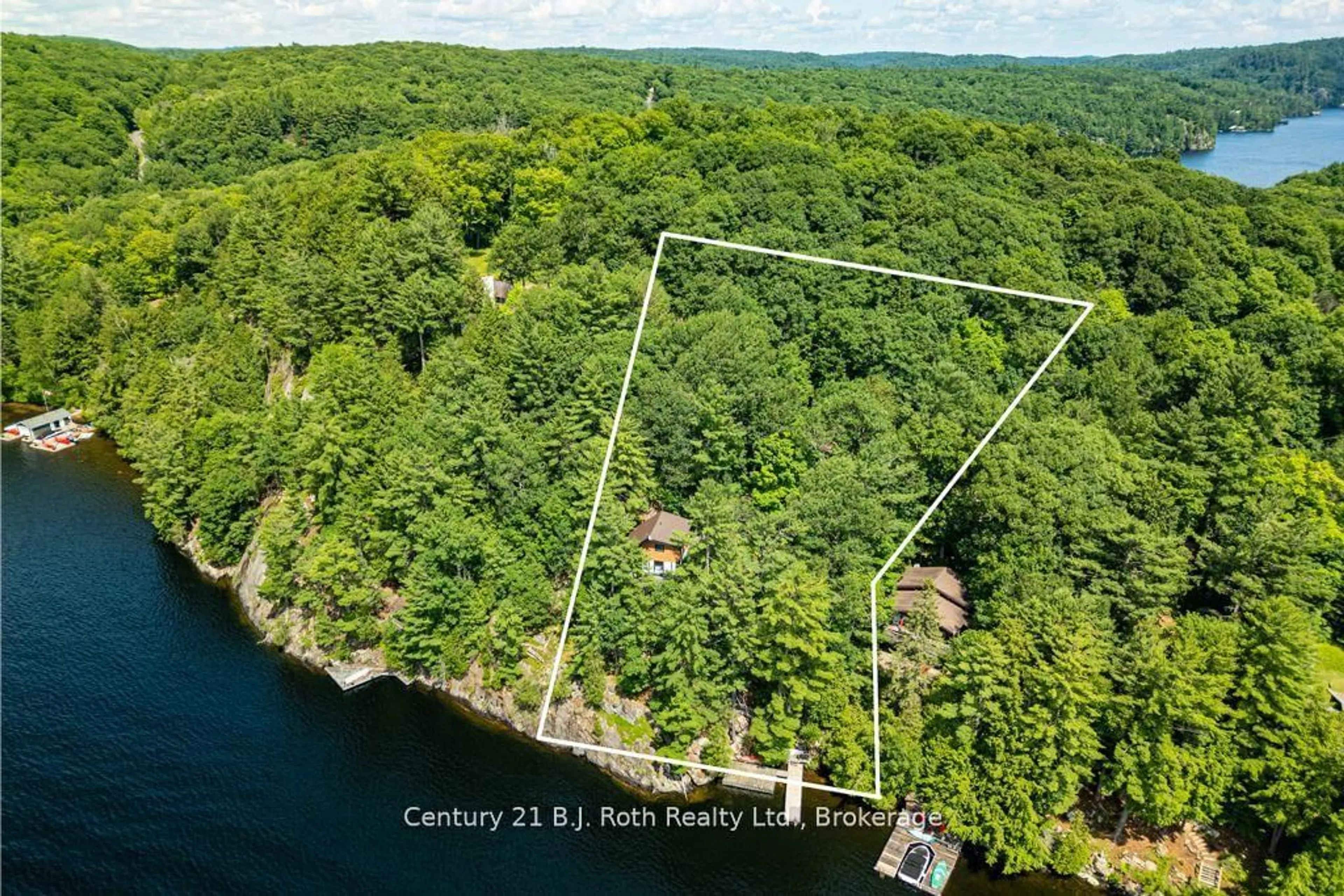 A pic from outside/outdoor area/front of a property/back of a property/a pic from drone, water/lake/river/ocean view for 1033 Bayview Point Rd, Lake of Bays Ontario P0A 1H0