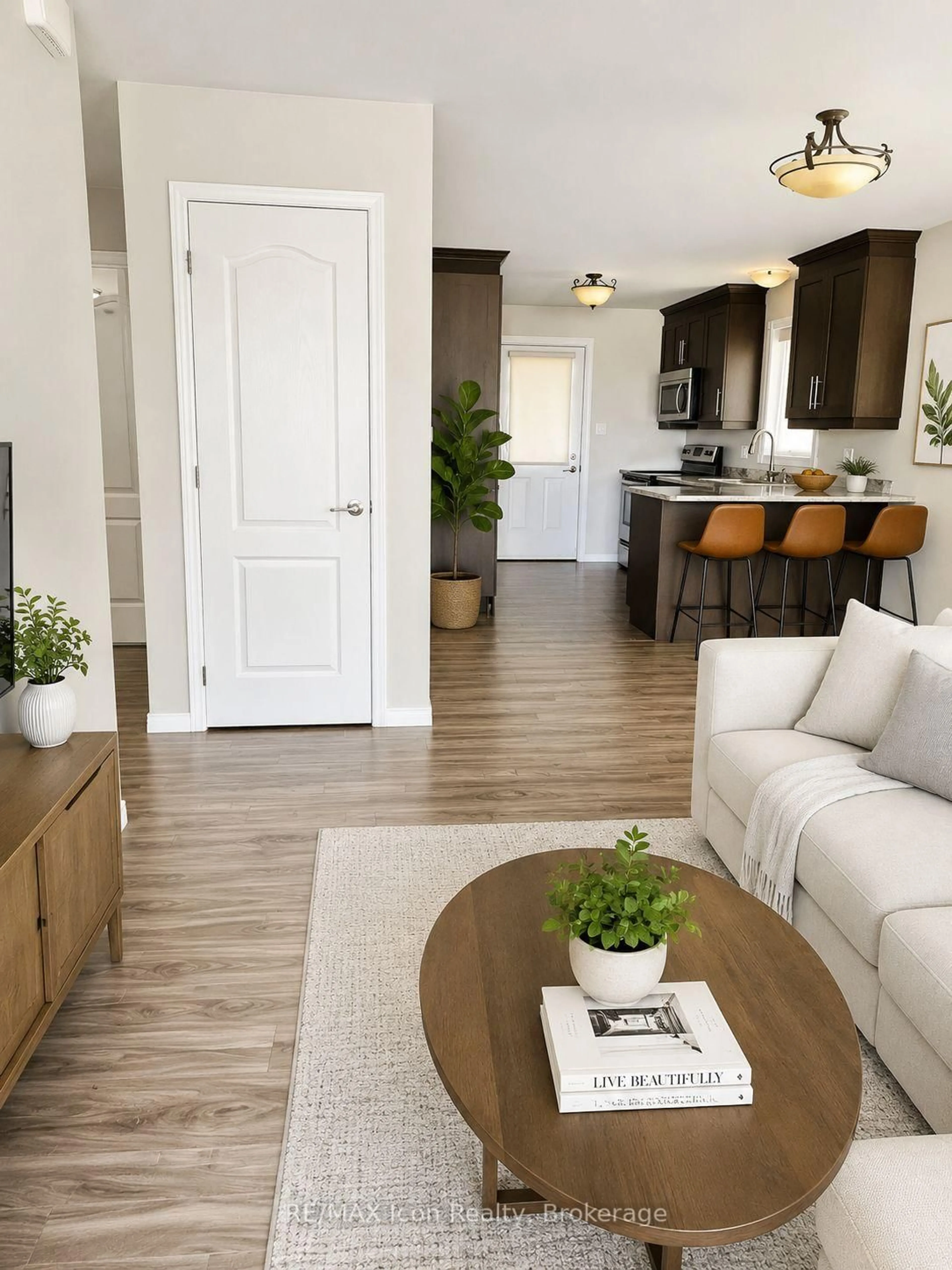 Living room with furniture, wood/laminate floor for 319 Nipissing St, West Nipissing Ontario P2B 3A7