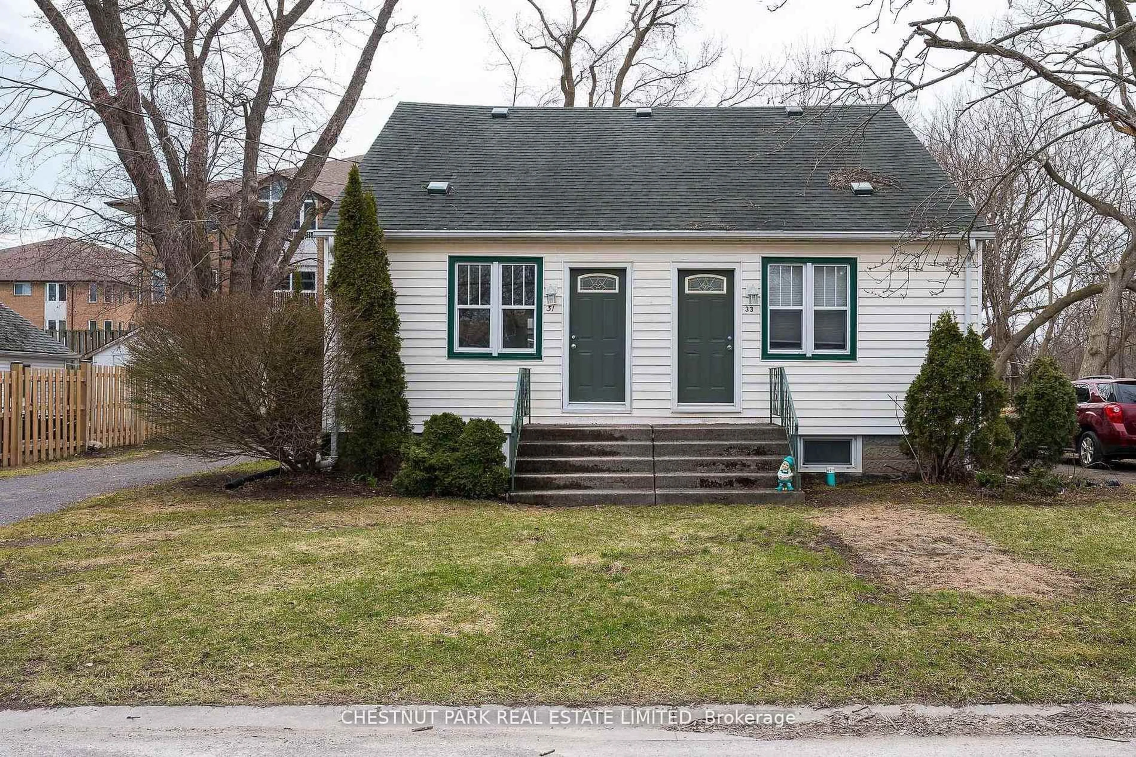 Home with vinyl exterior material, street for 31-33 Washburn St, Prince Edward County Ontario K0K 2T0