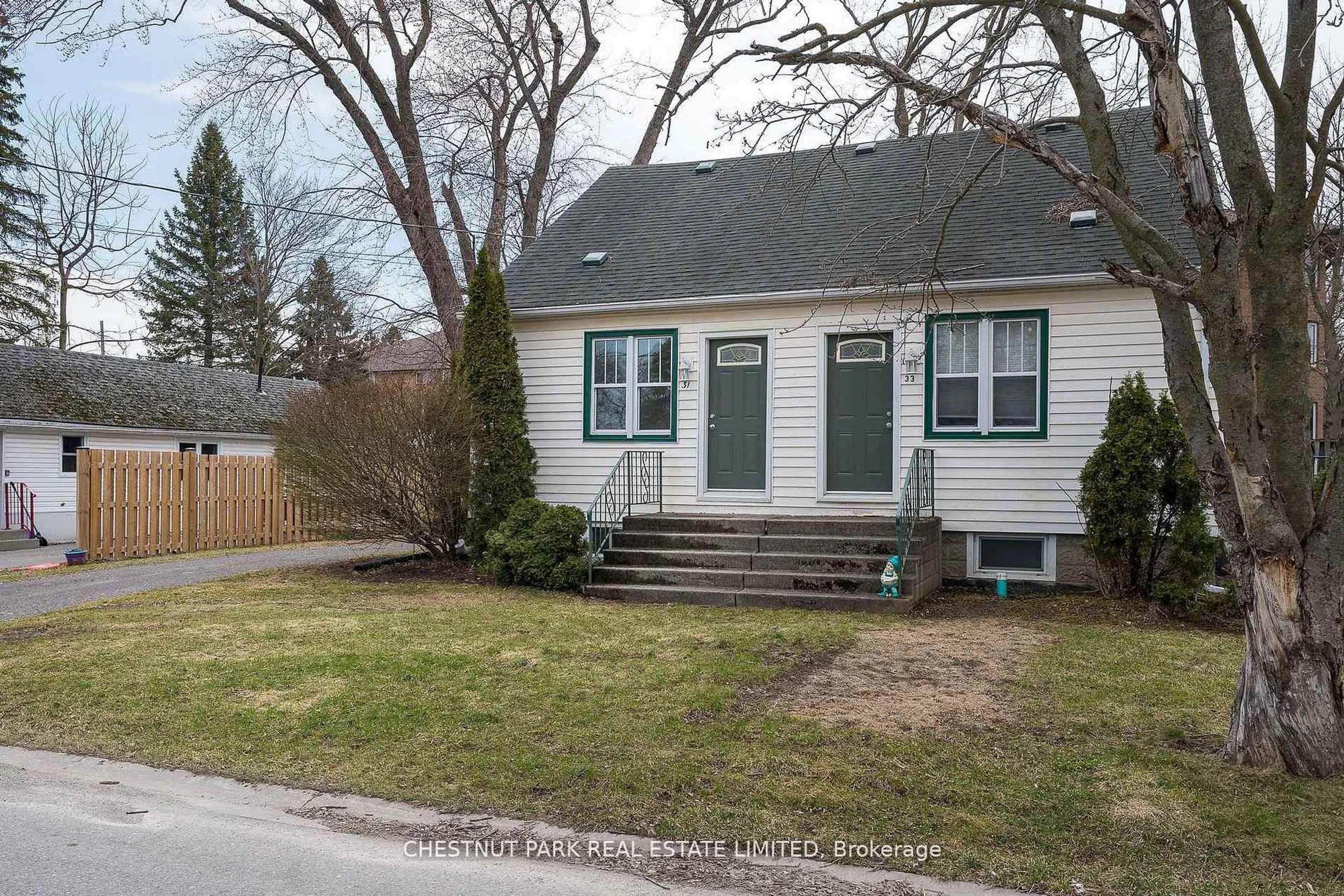 Home with vinyl exterior material, street for 31-33 Washburn St, Prince Edward County Ontario K0K 2T0