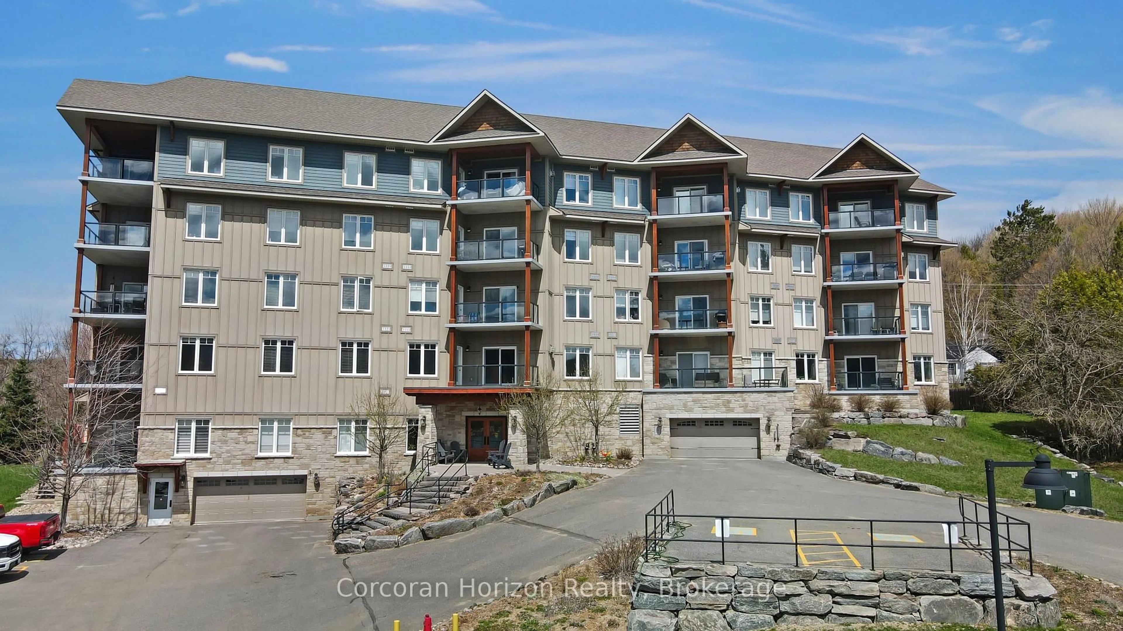 A pic from outside/outdoor area/front of a property/back of a property/a pic from drone, water/lake/river/ocean view for 1 Park St #105, Dysart et al Ontario K0M 1S0
