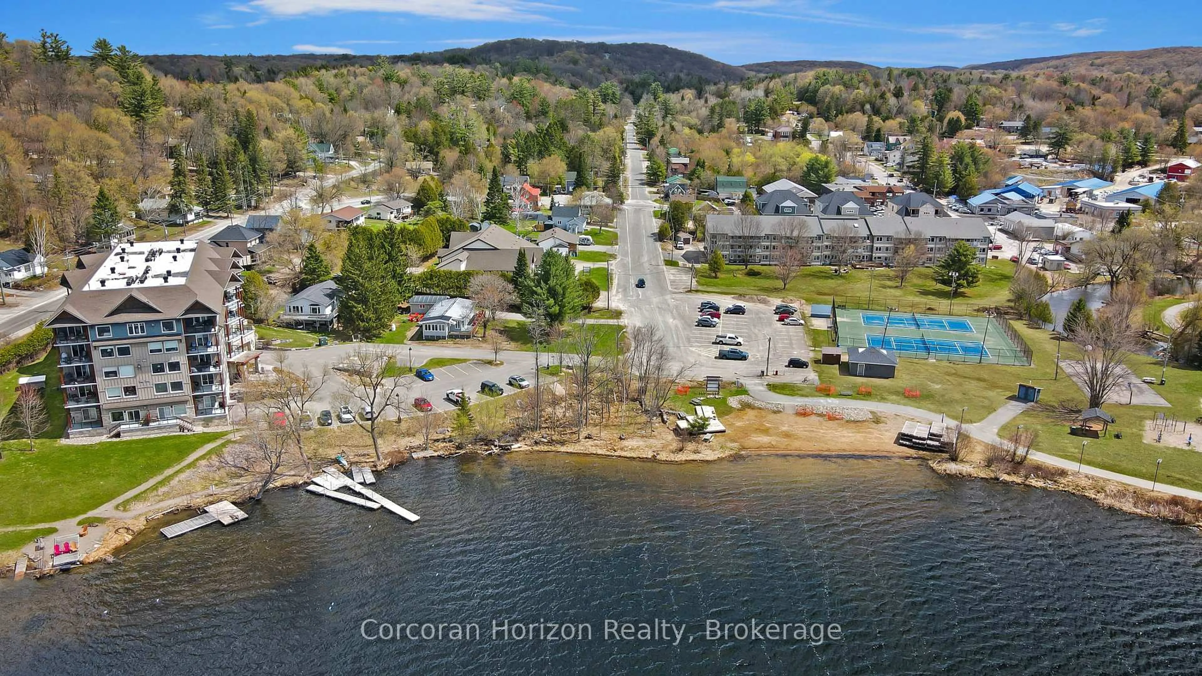 A pic from outside/outdoor area/front of a property/back of a property/a pic from drone, water/lake/river/ocean view for 1 Park St #105, Dysart et al Ontario K0M 1S0