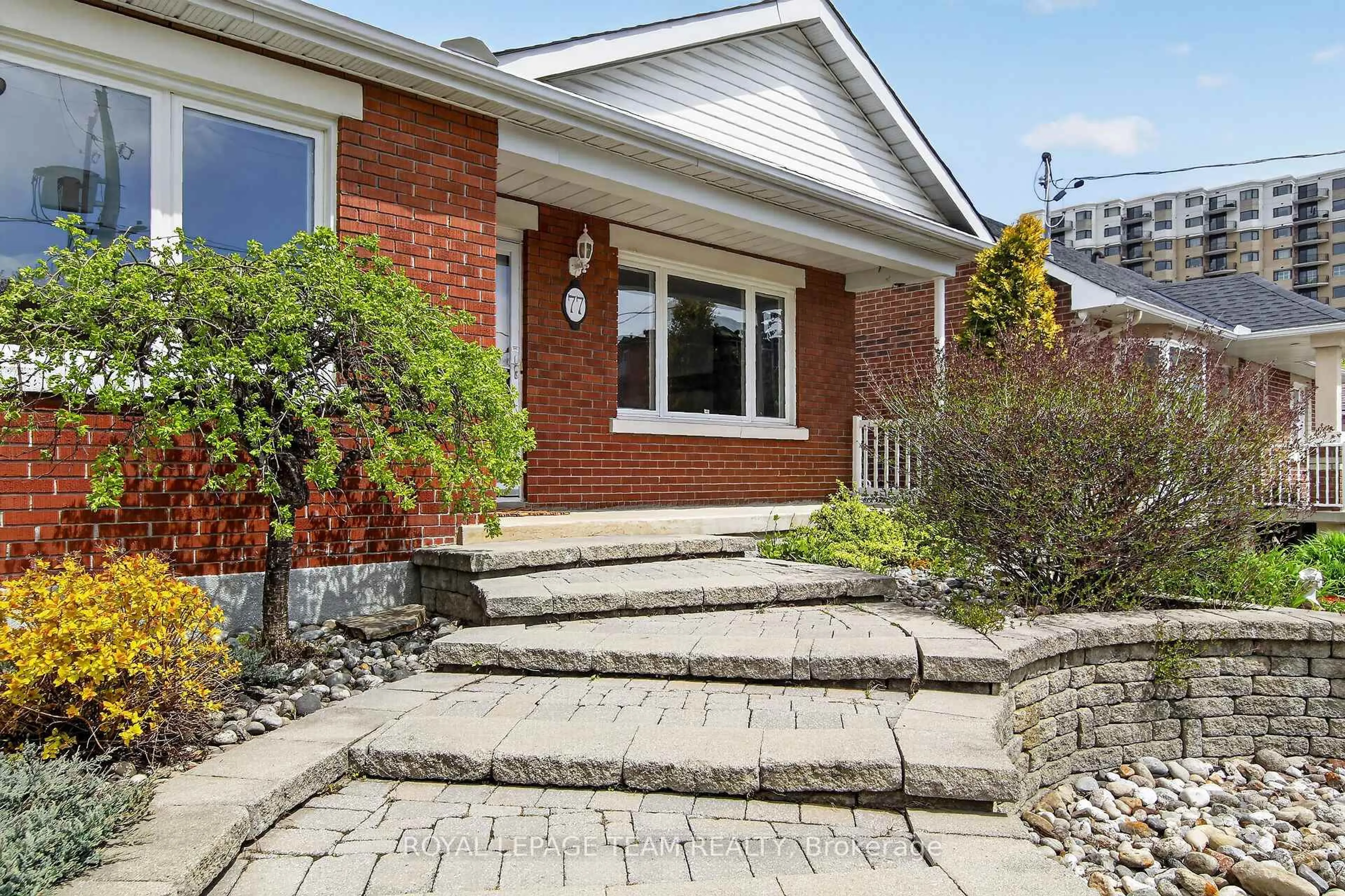 Home with brick exterior material, street for 77 West Presland Rd, Ottawa Ontario K1K 2C2