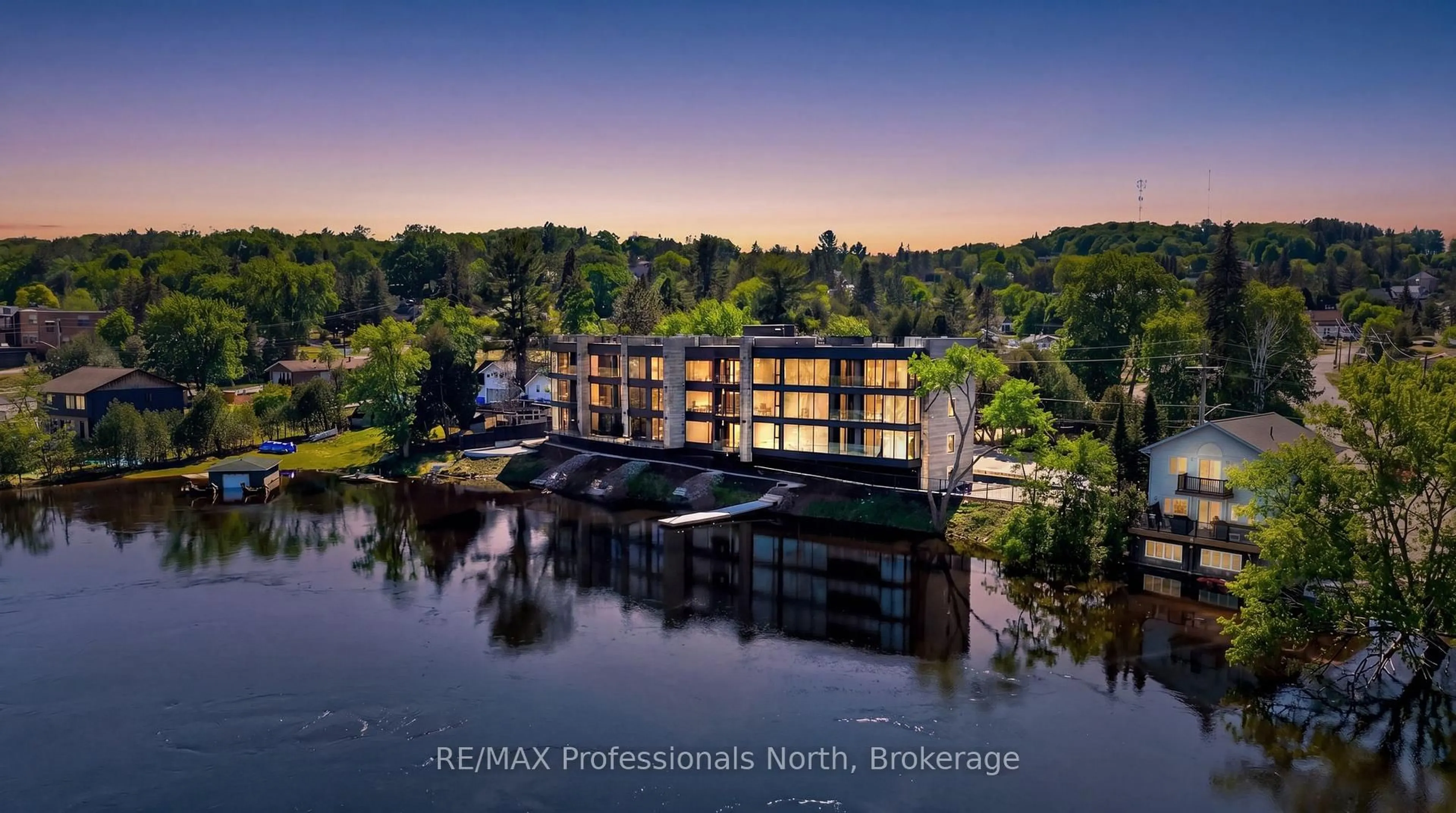 A pic from outside/outdoor area/front of a property/back of a property/a pic from drone, water/lake/river/ocean view for 32 BRUNEL Rd #303, Huntsville Ontario P1H 1P5
