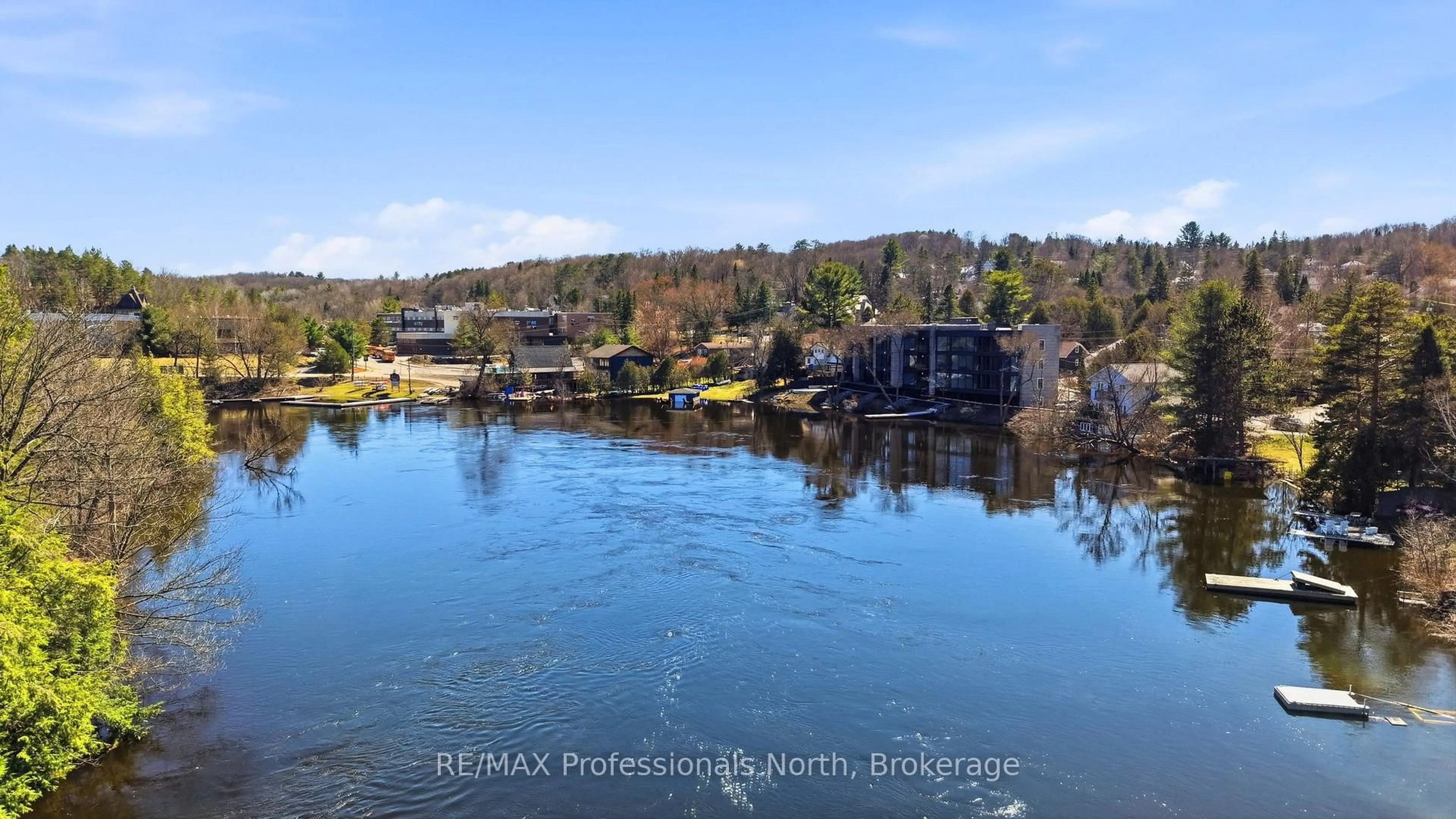 A pic from outside/outdoor area/front of a property/back of a property/a pic from drone, water/lake/river/ocean view for 32 BRUNEL Rd #303, Huntsville Ontario P1H 1P5
