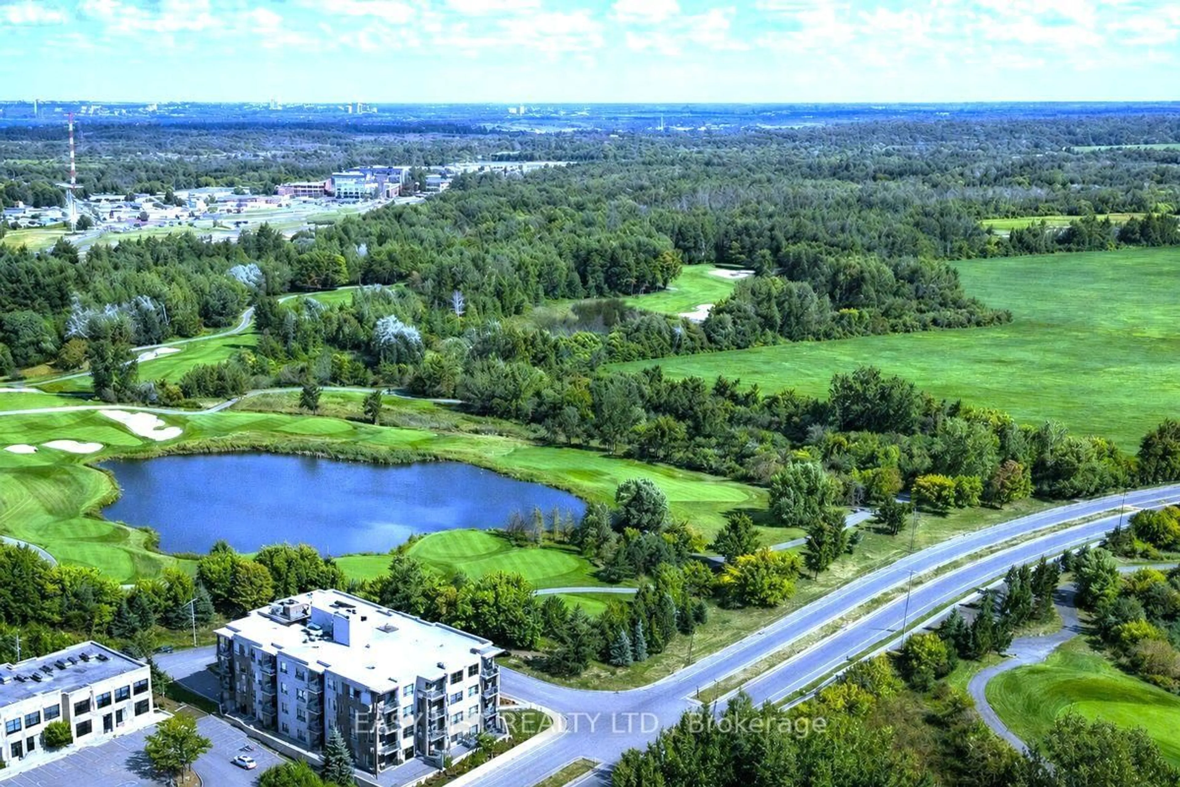 A pic from outside/outdoor area/front of a property/back of a property/a pic from drone, water/lake/river/ocean view for 280 Herzberg Rd #404, Ottawa Ontario K2K 1X7