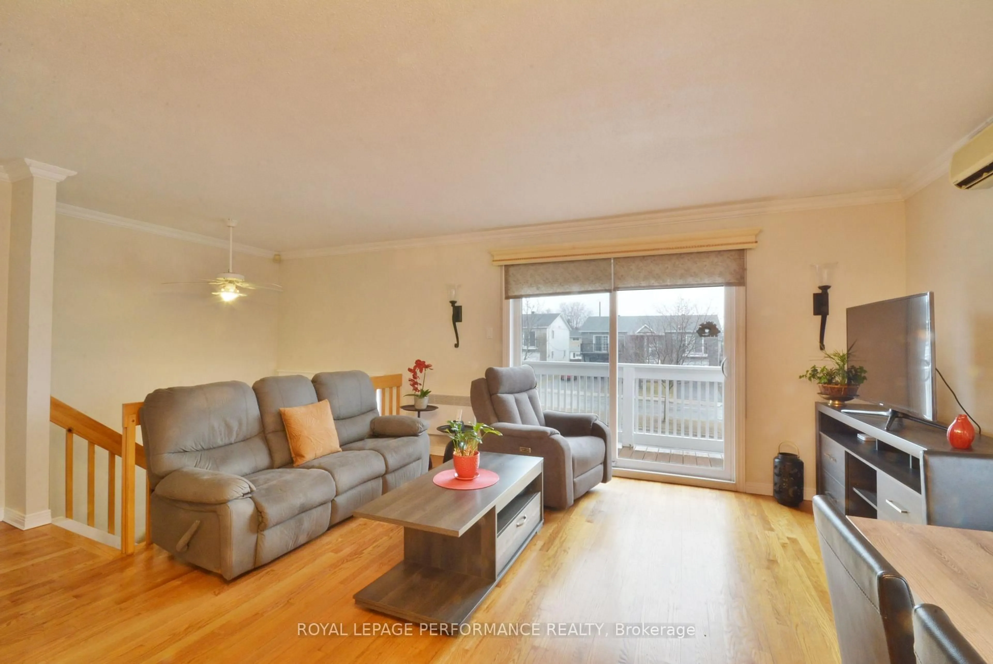 Living room with furniture, wood/laminate floor for 443 Tupper St, Hawkesbury Ontario K6A 3L9