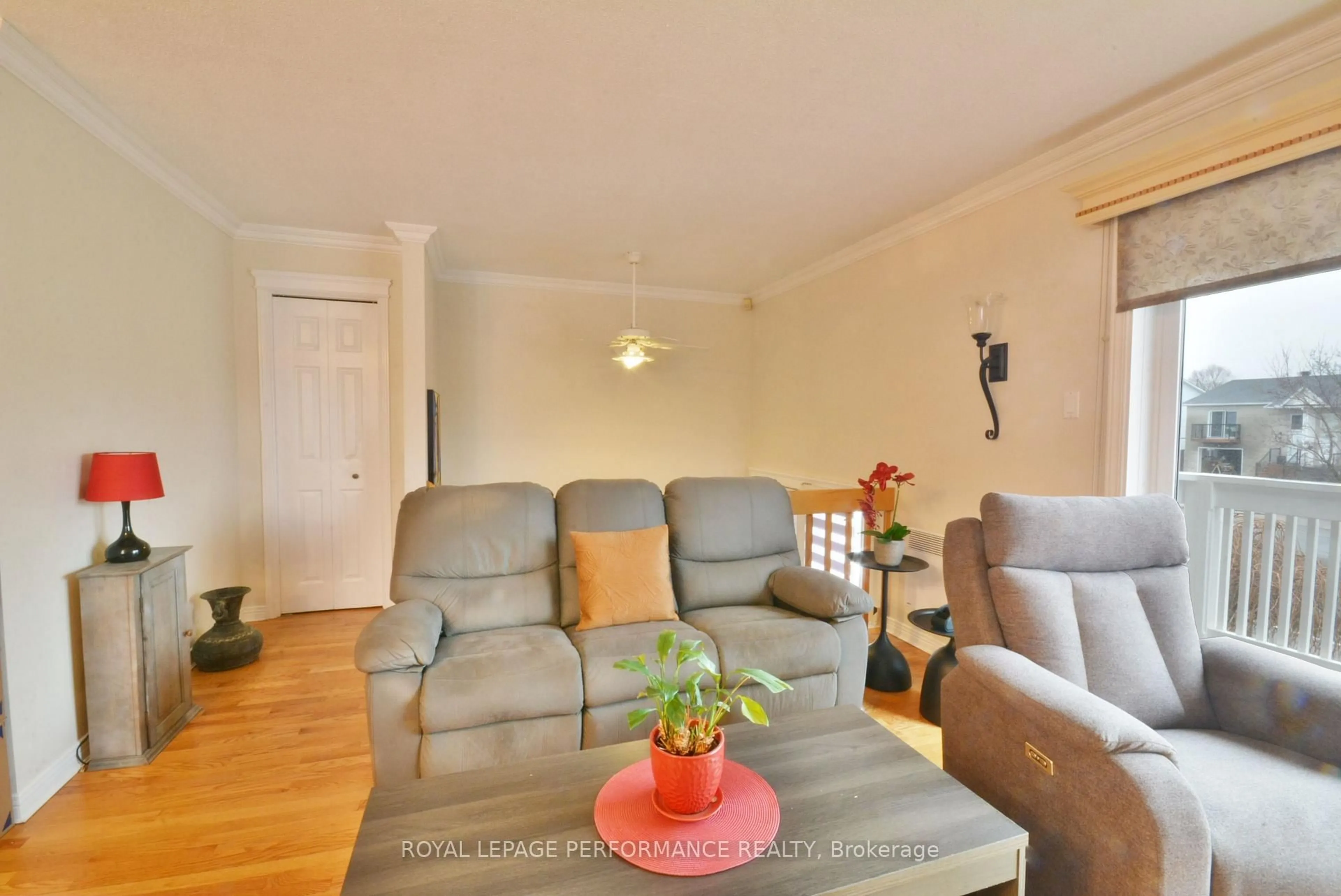 Living room with furniture, wood/laminate floor for 443 Tupper St, Hawkesbury Ontario K6A 3L9