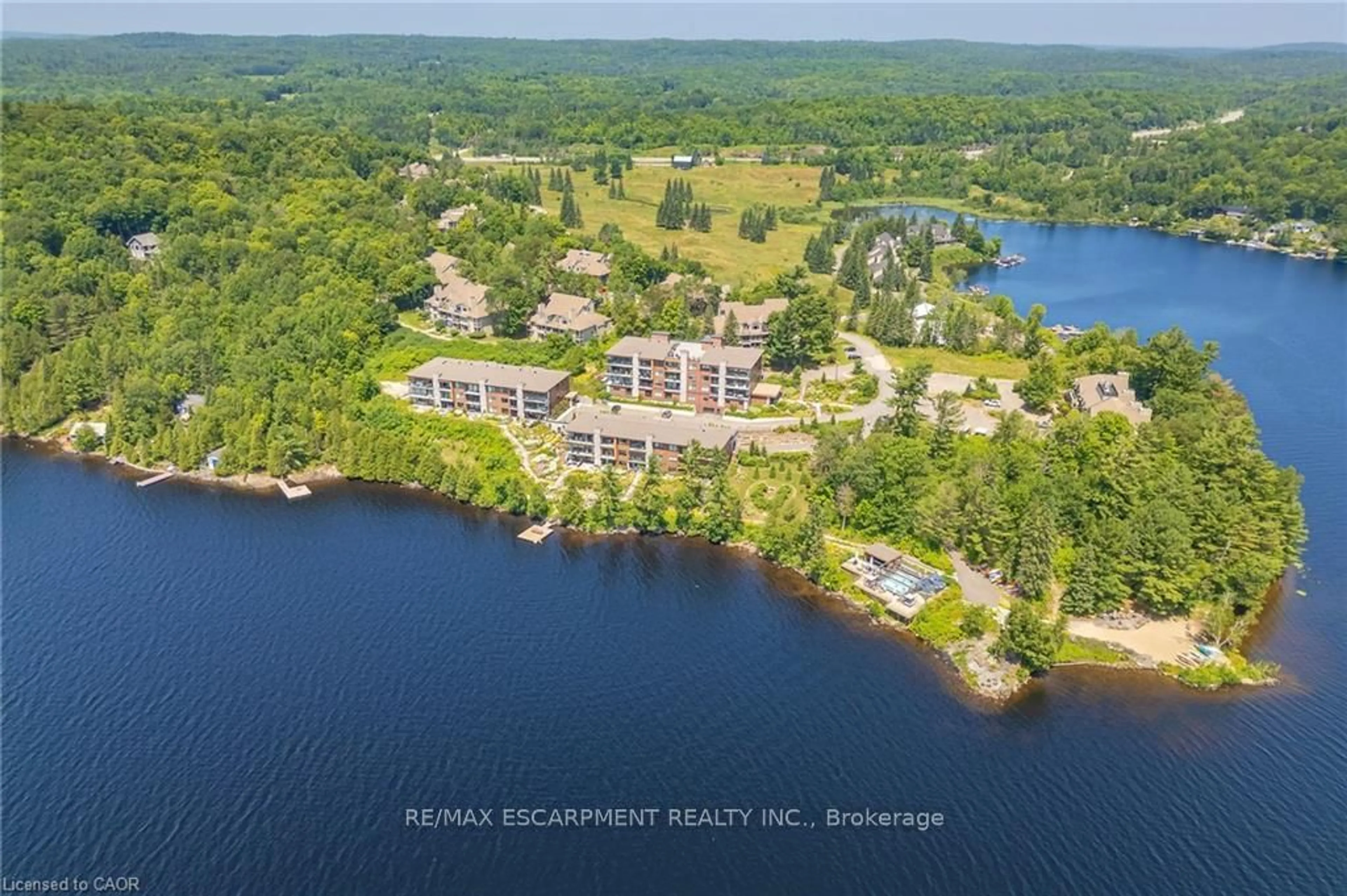 A pic from outside/outdoor area/front of a property/back of a property/a pic from drone, water/lake/river/ocean view for 131 Grandview Hilltop Dr #1, Huntsville Ontario P1H 2J5