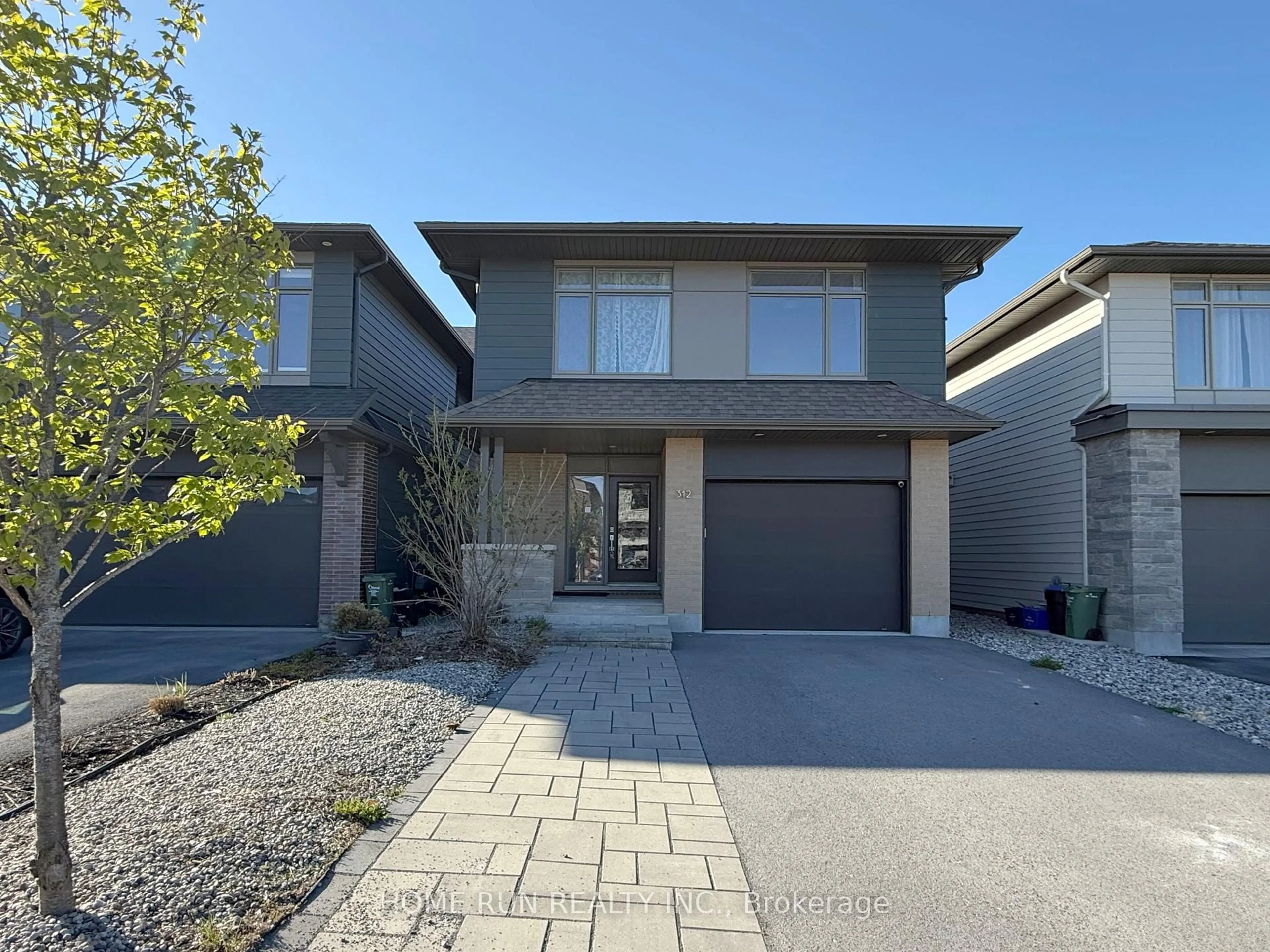 Home with brick exterior material, street for 312 Lysander Pl, Ottawa Ontario K1K 4K7