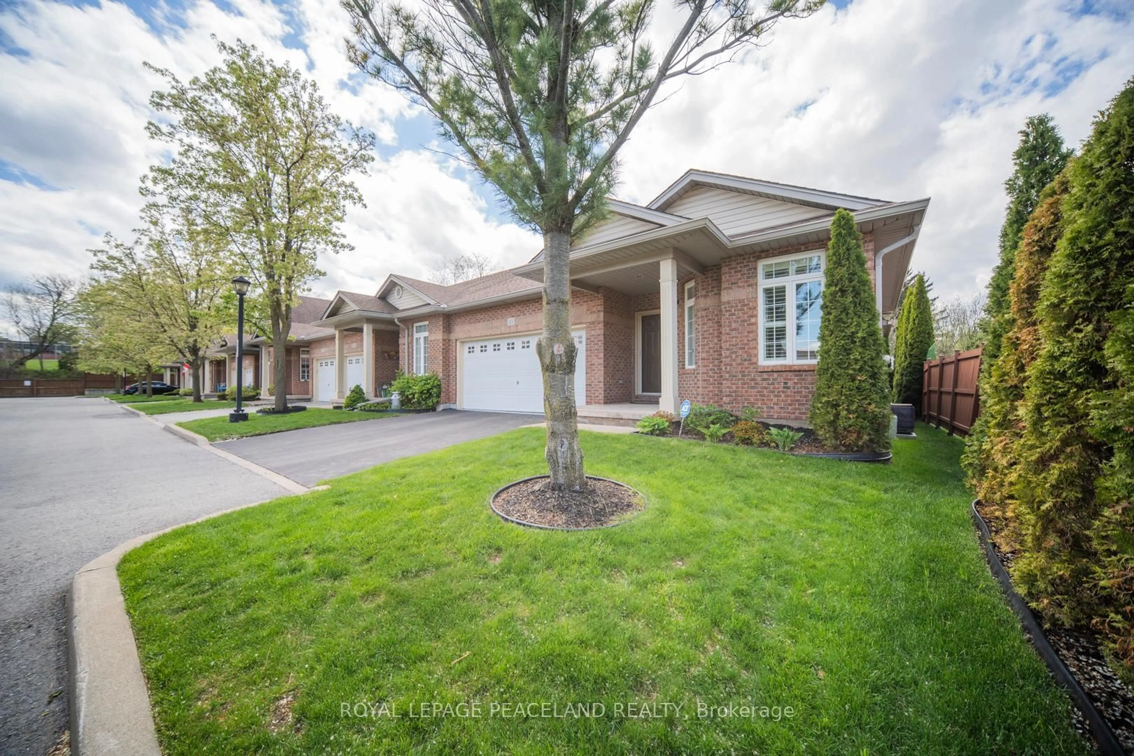 Home with brick exterior material, street for 5595 Drummond Rd #11, Niagara Falls Ontario L2G 4L2
