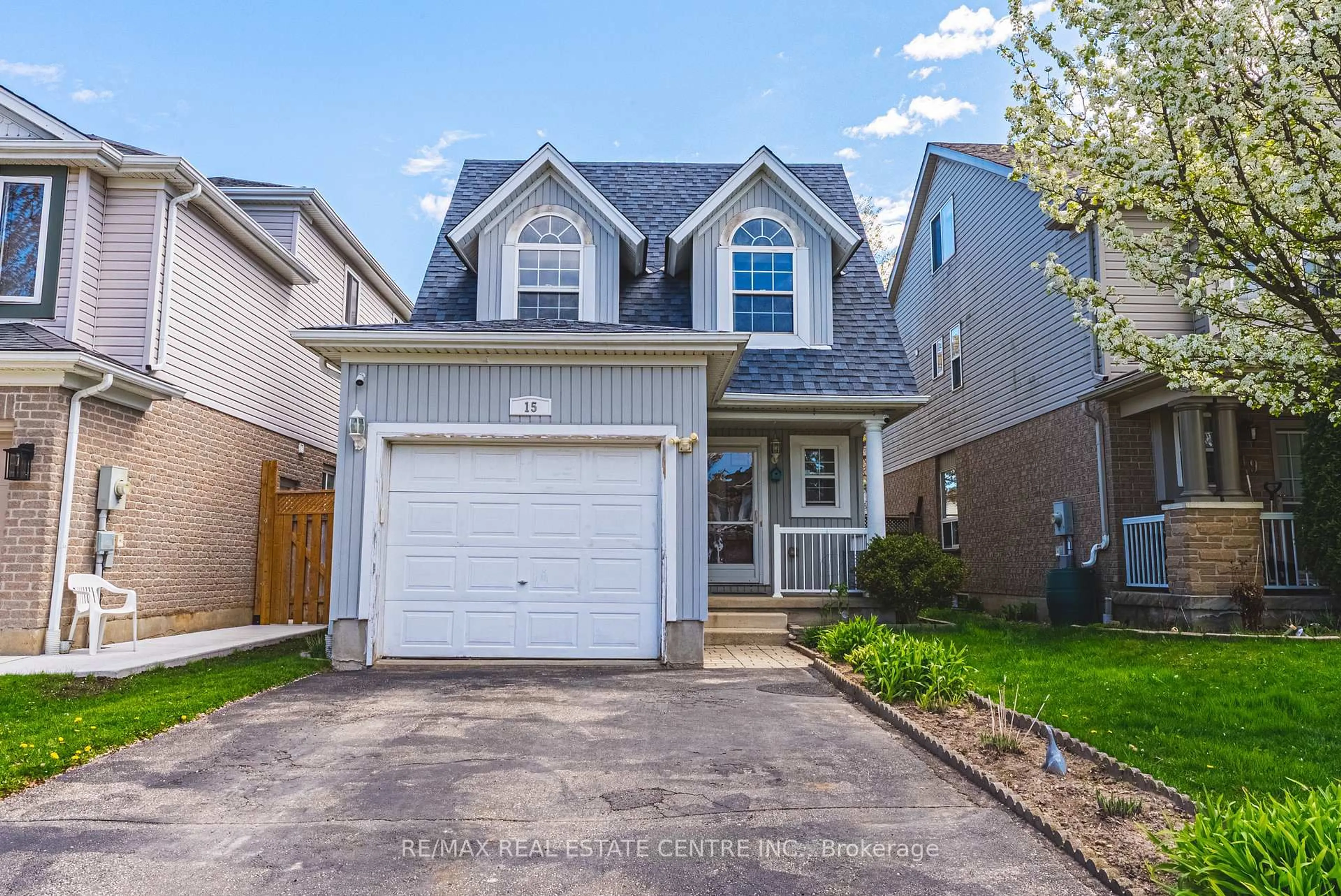 Home with vinyl exterior material, street for 15 Lardner St, Cambridge Ontario N3C 4K6