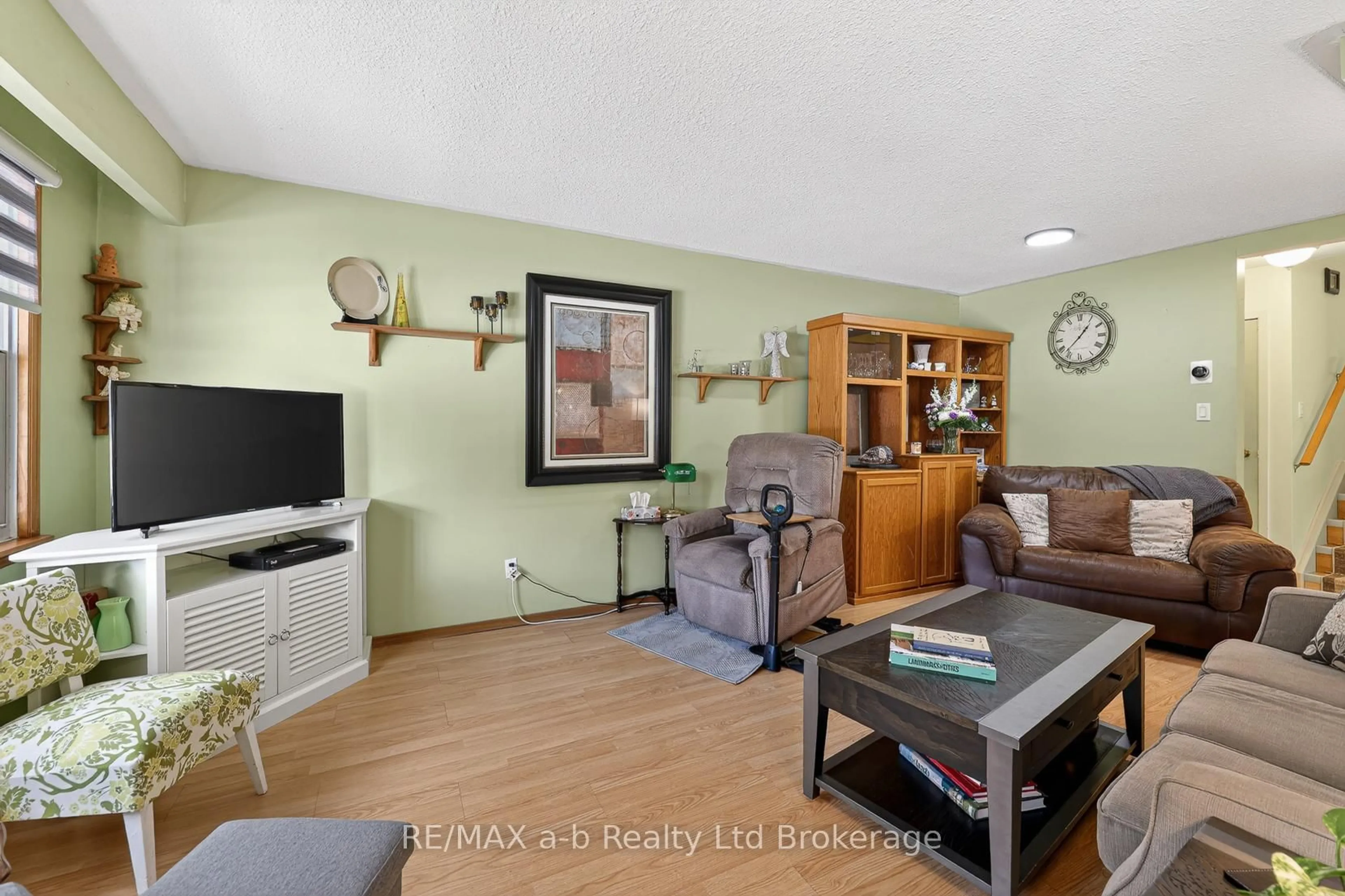 Living room with furniture, wood/laminate floor for 13 Witty Ave, Ingersoll Ontario N5C 3N9