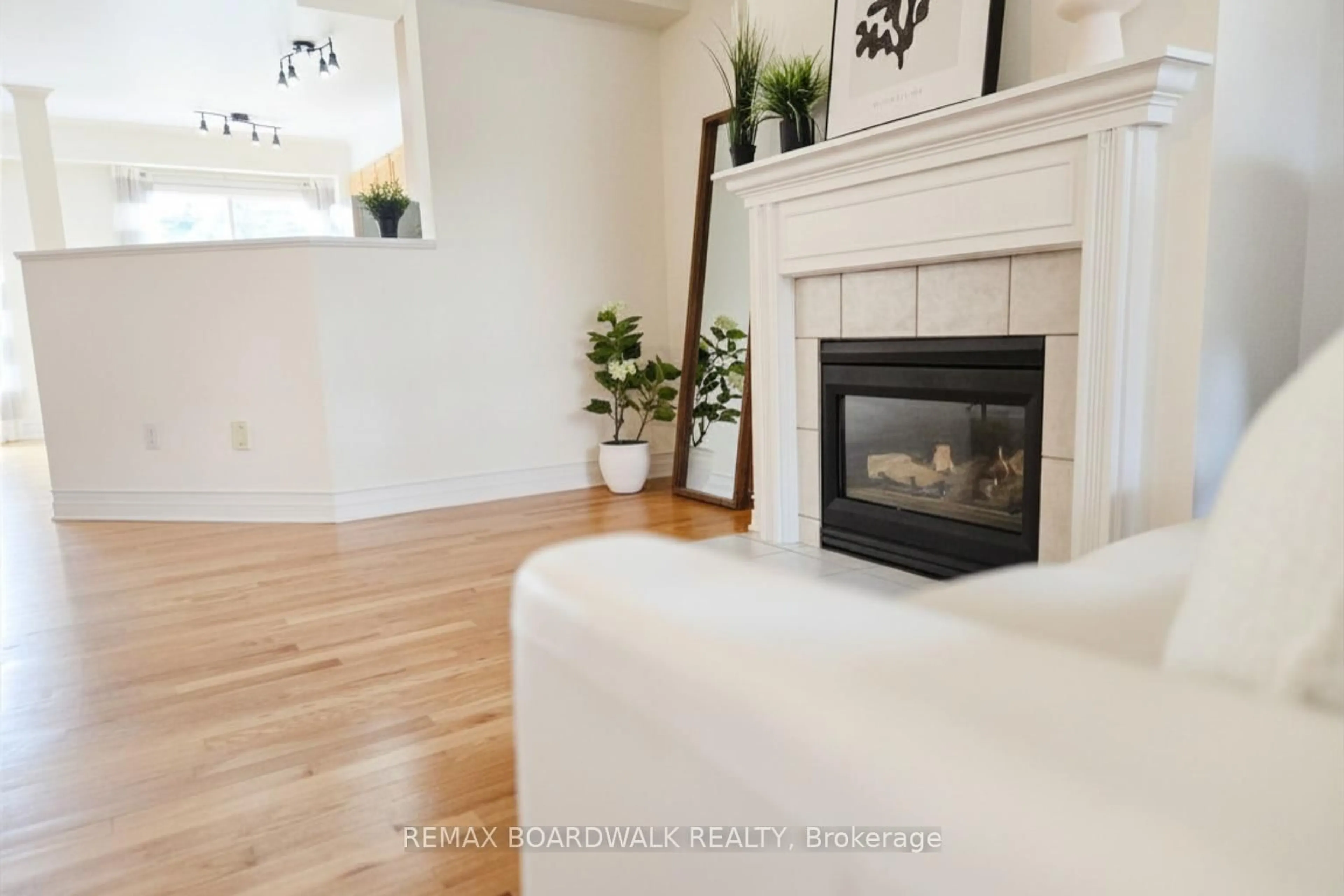 Living room with furniture, wood/laminate floor for 42 College Circ, Ottawa Ontario K1K 4R8