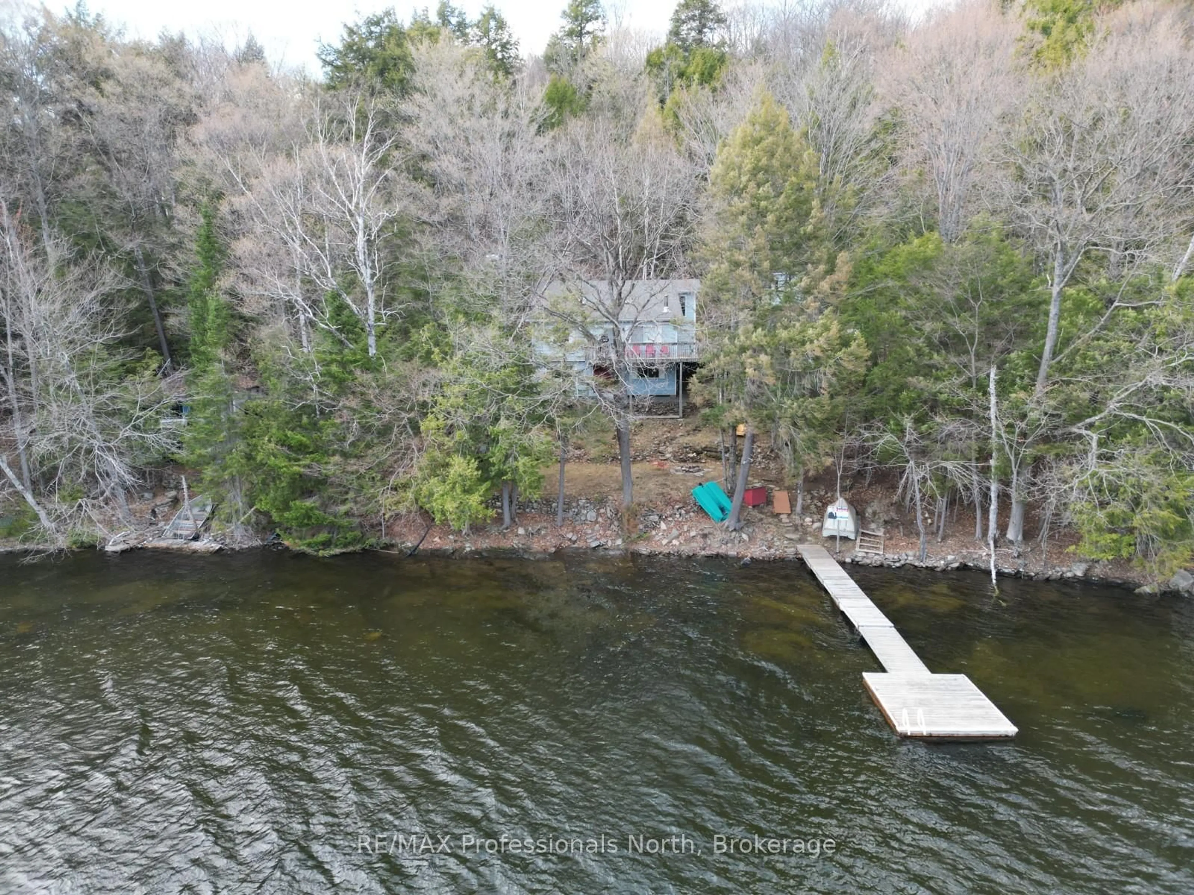 A pic from outside/outdoor area/front of a property/back of a property/a pic from drone, water/lake/river/ocean view for 1847 Chandler Dr, Dysart et al Ontario K0M 1S0