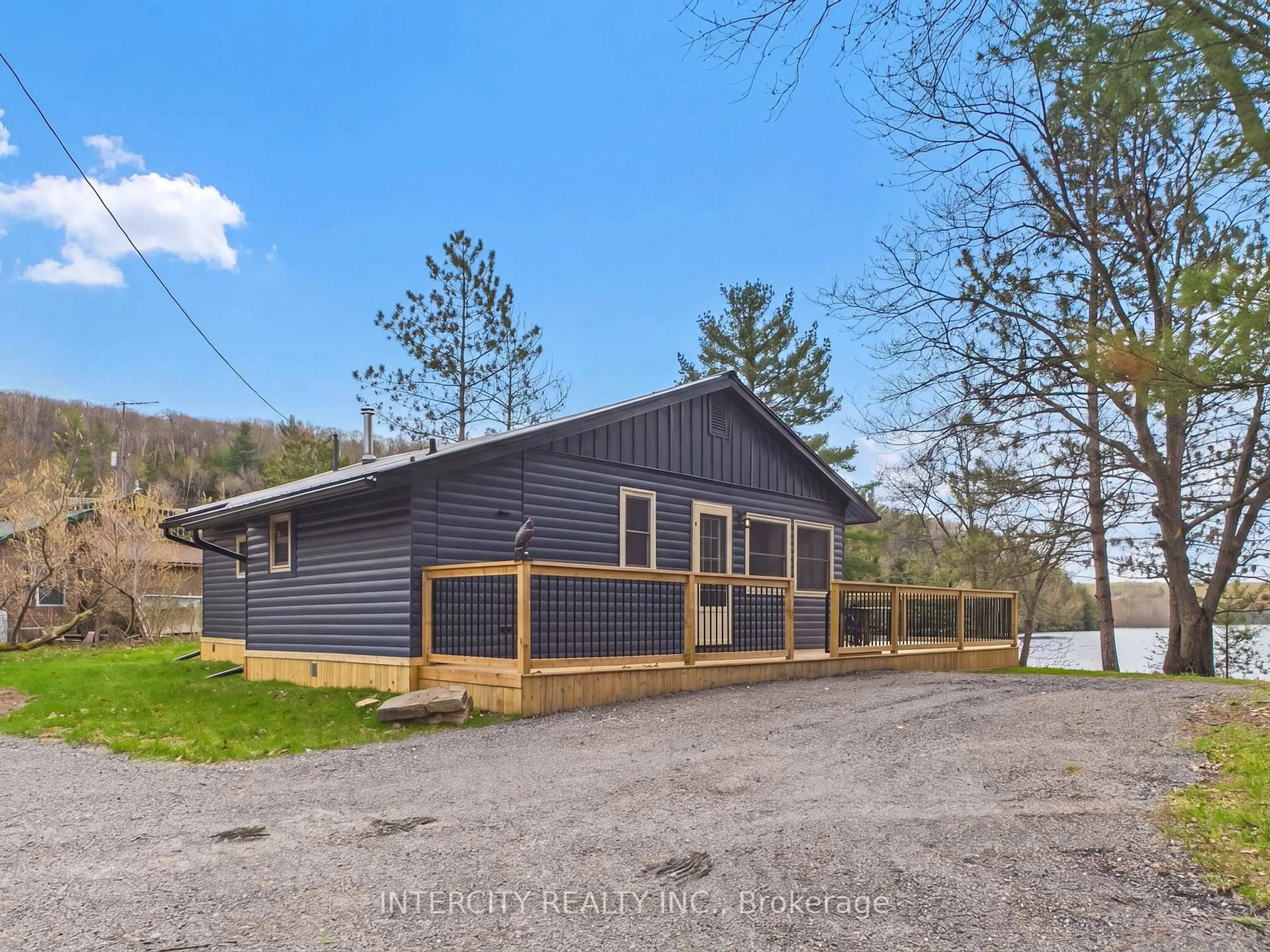 A pic from outside/outdoor area/front of a property/back of a property/a pic from drone, unknown for 1052 Cove Rd #3, Muskoka Lakes Ontario L0B 1M0