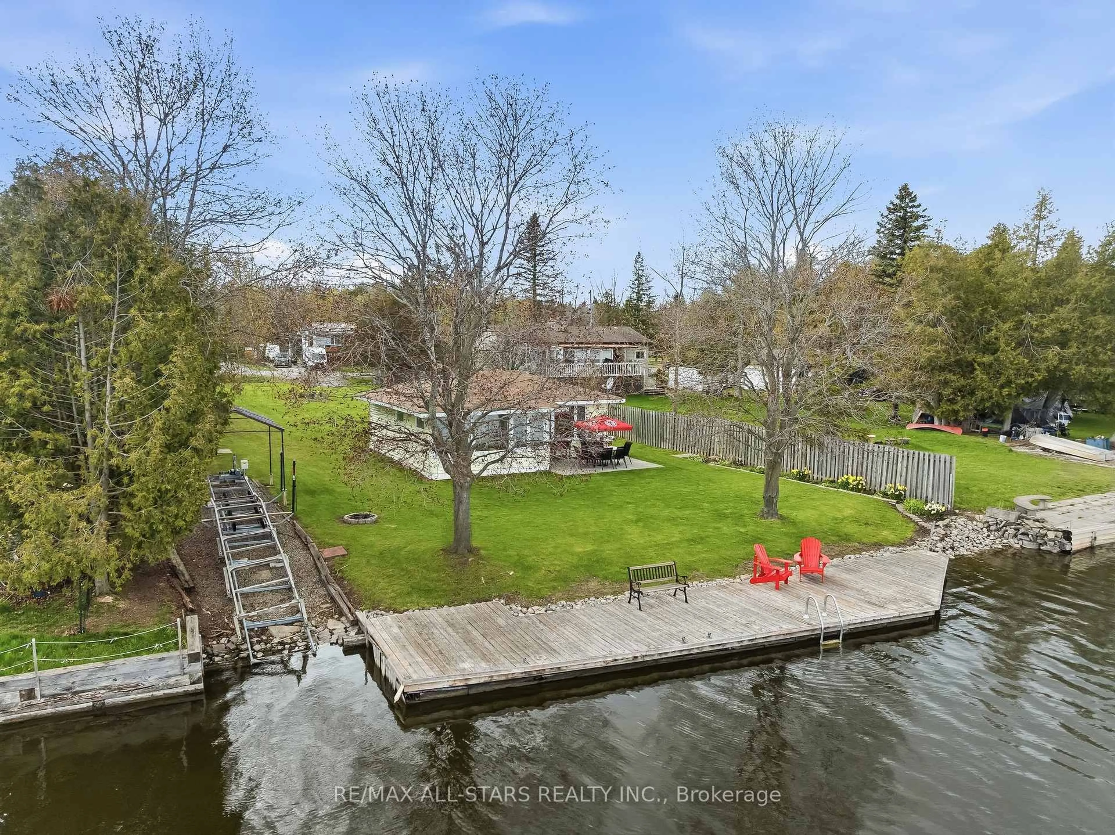 A pic from outside/outdoor area/front of a property/back of a property/a pic from drone, water/lake/river/ocean view for 42 Riverside Dr, Kawartha Lakes Ontario K9V 0H6