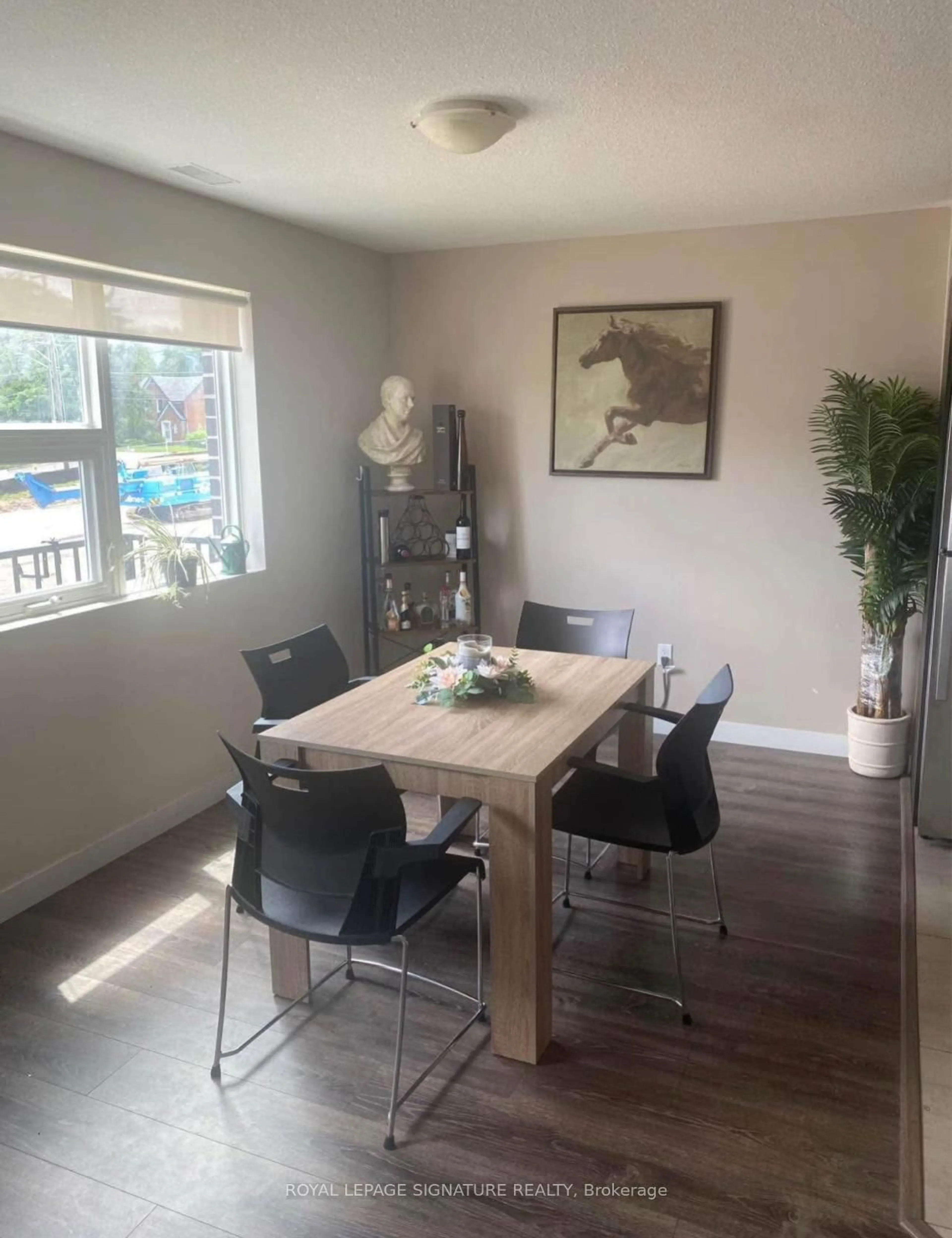 Dining room, wood/laminate floor for 288 Albert St #216, Waterloo Ontario N2L 3T8