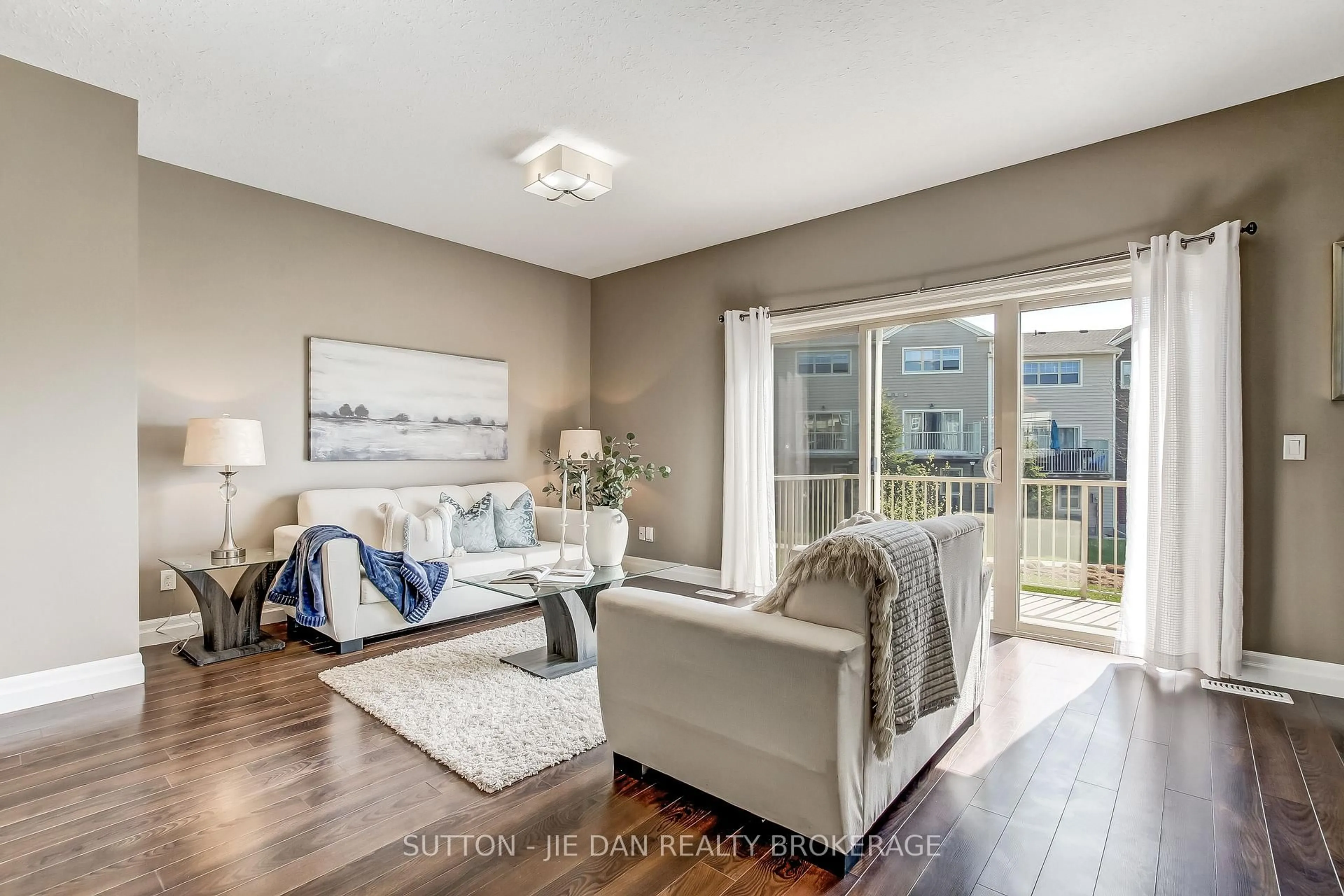 Living room with furniture, wood/laminate floor for 1850 BEAVERBROOK Ave #9, London North Ontario N6H 0G7