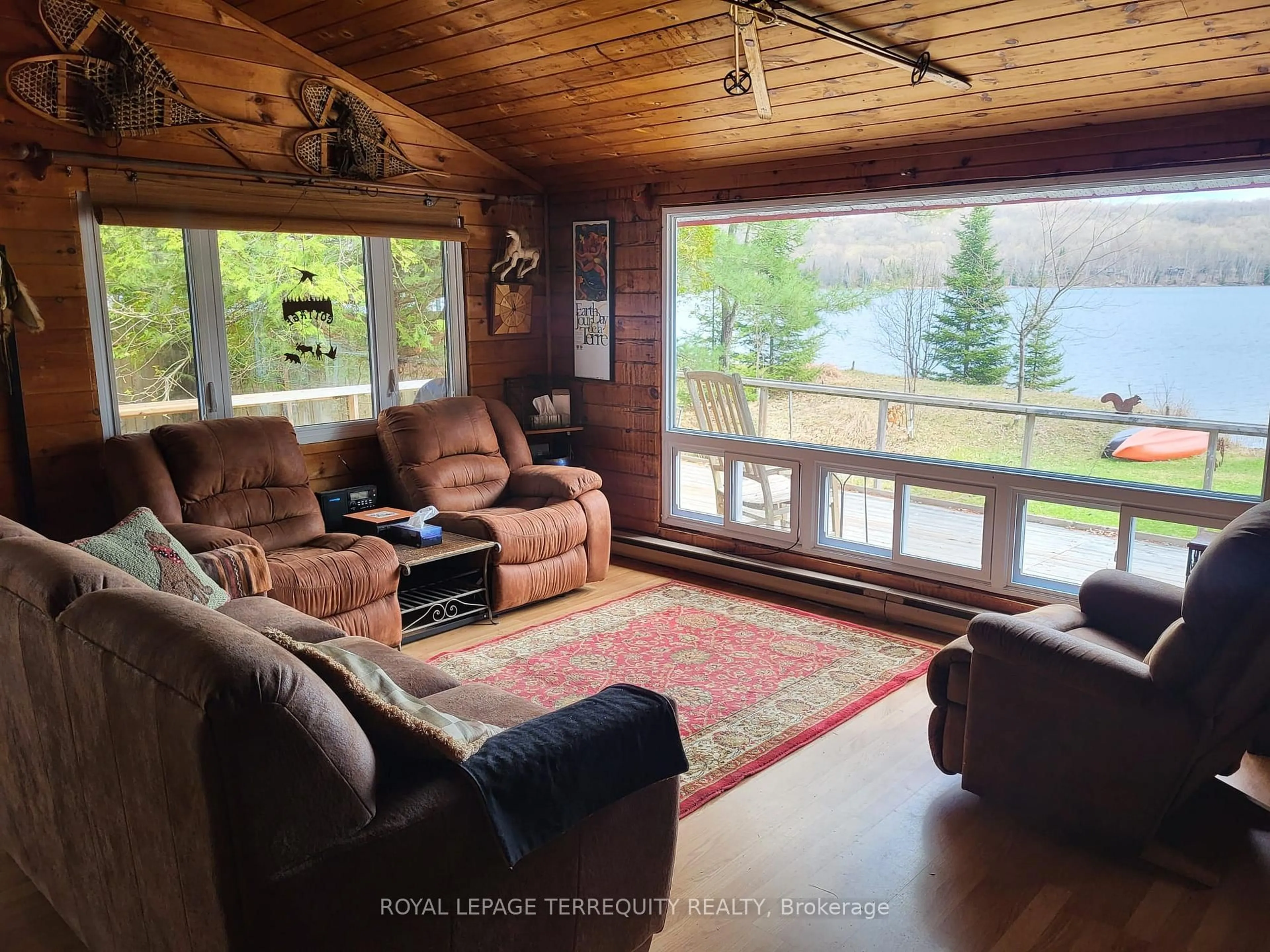 Living room with furniture, wood/laminate floor for 1012 Shamrock Lane, Dysart et al Ontario K0M 1S0