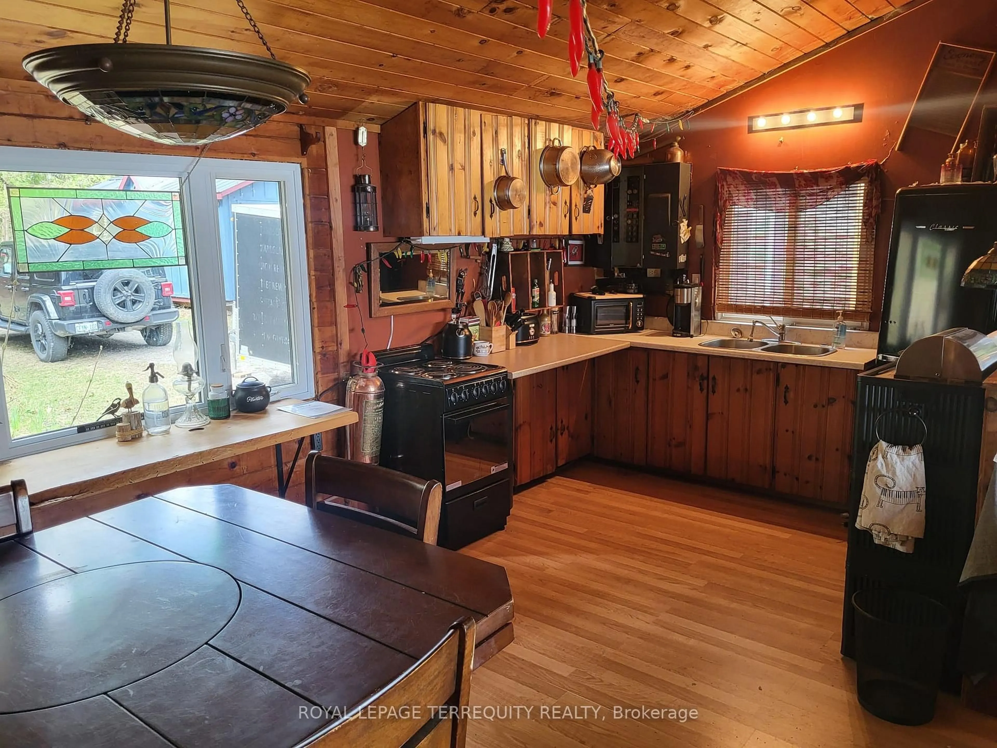Open concept kitchen, wood/laminate floor for 1012 Shamrock Lane, Dysart et al Ontario K0M 1S0