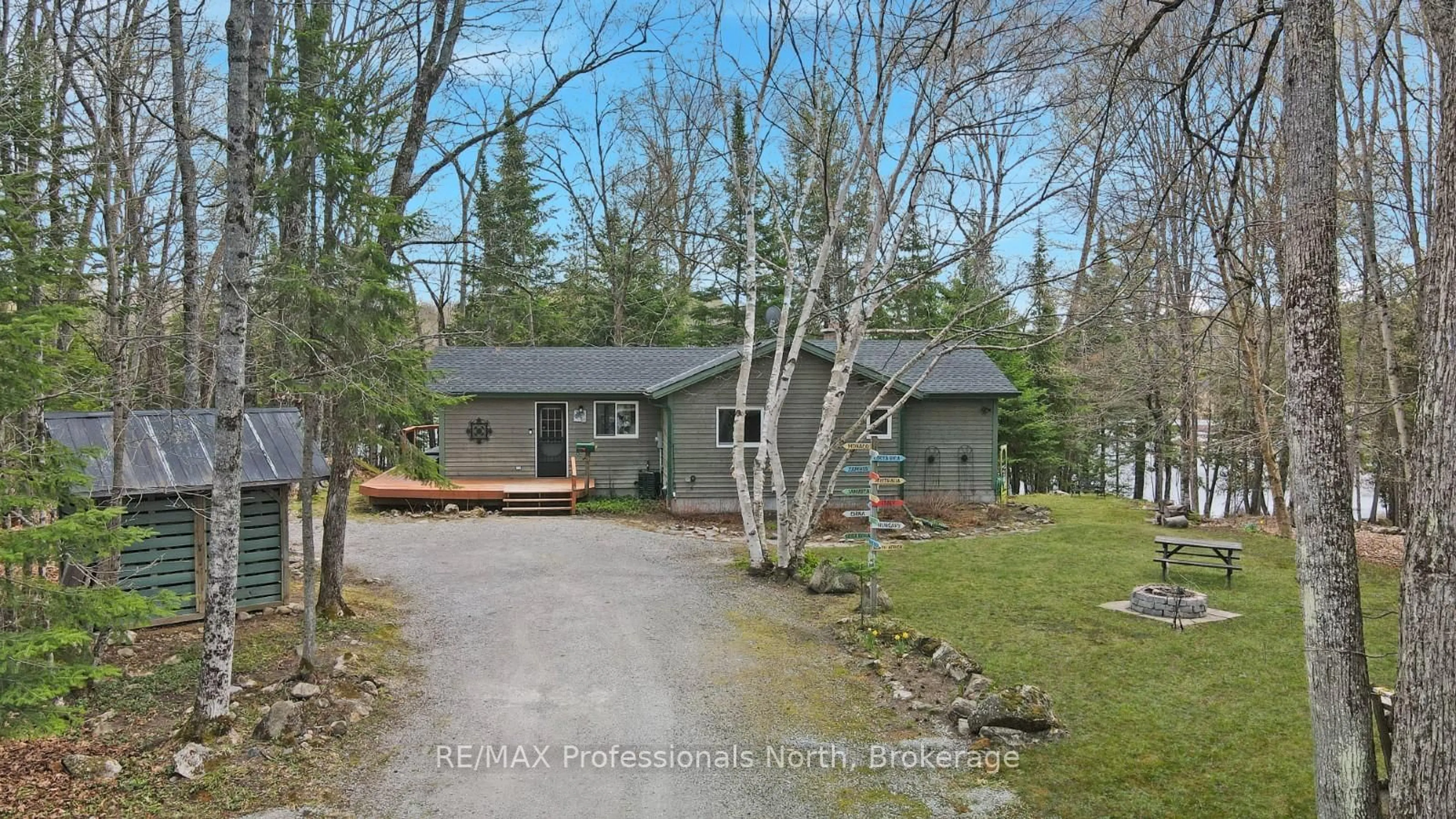 A pic from outside/outdoor area/front of a property/back of a property/a pic from drone, street for 1157 Between Lakes Tr, Minden Hills Ontario K0M 1J1