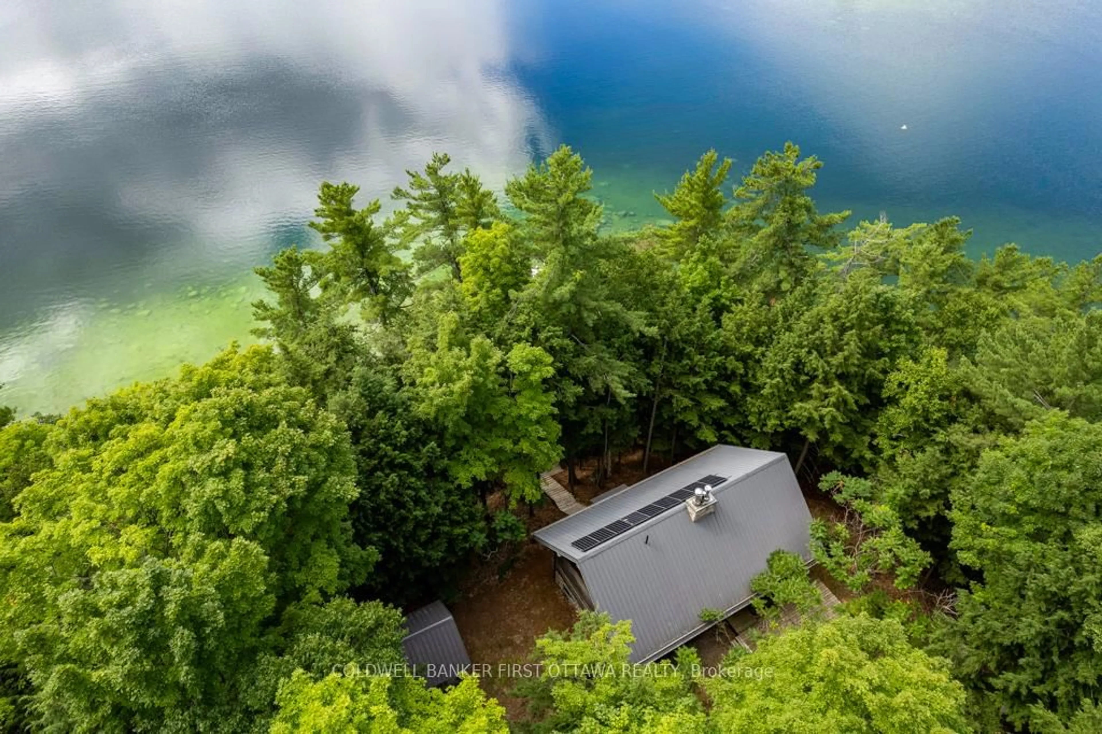 A pic from outside/outdoor area/front of a property/back of a property/a pic from drone, water/lake/river/ocean view for 2275 Palmerston Lake, Ompah Ontario K0H 2J0