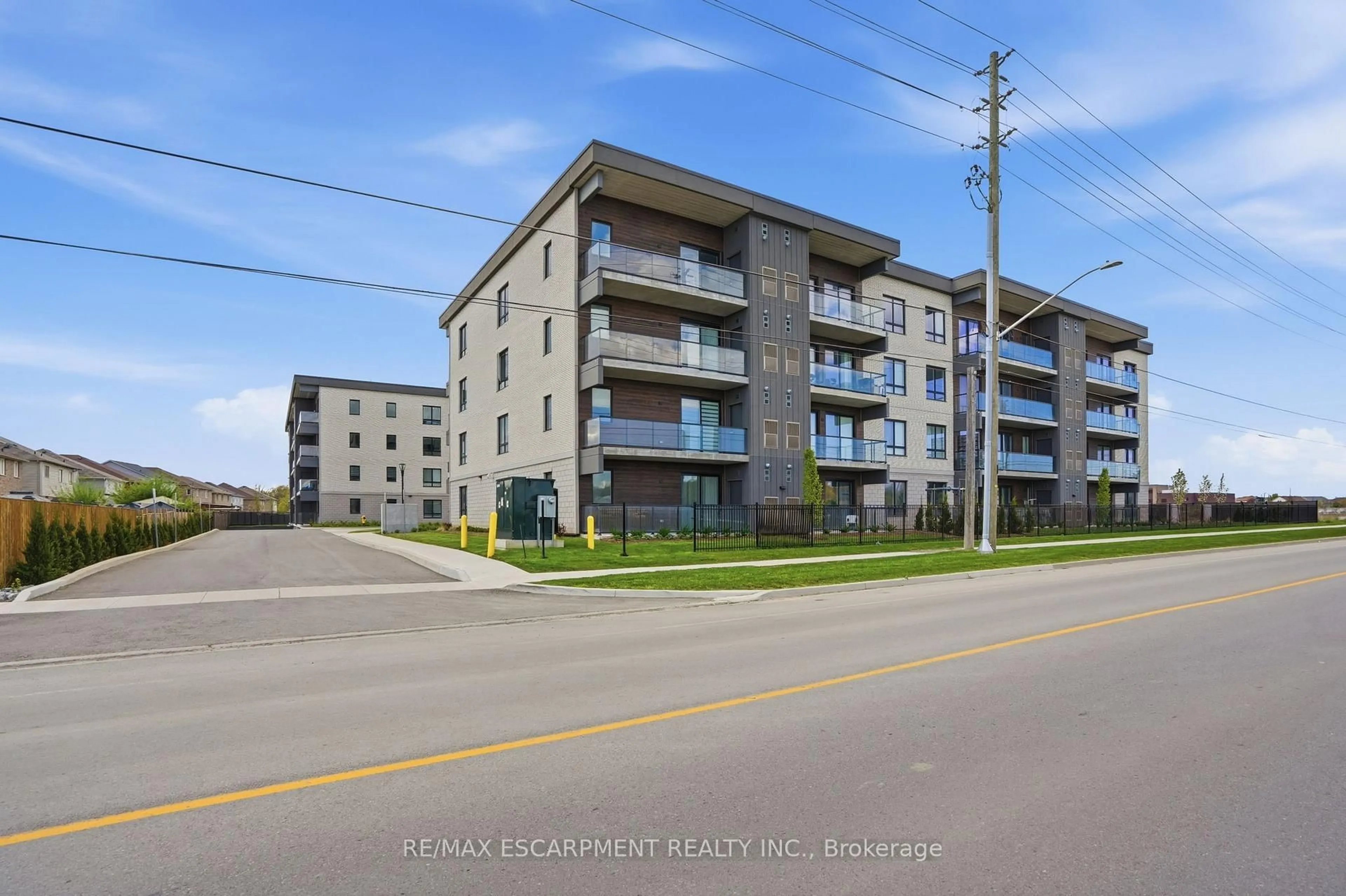 A pic from outside/outdoor area/front of a property/back of a property/a pic from drone, street for 7549B Kalar Rd #315, Niagara Falls Ontario L2H 3W7