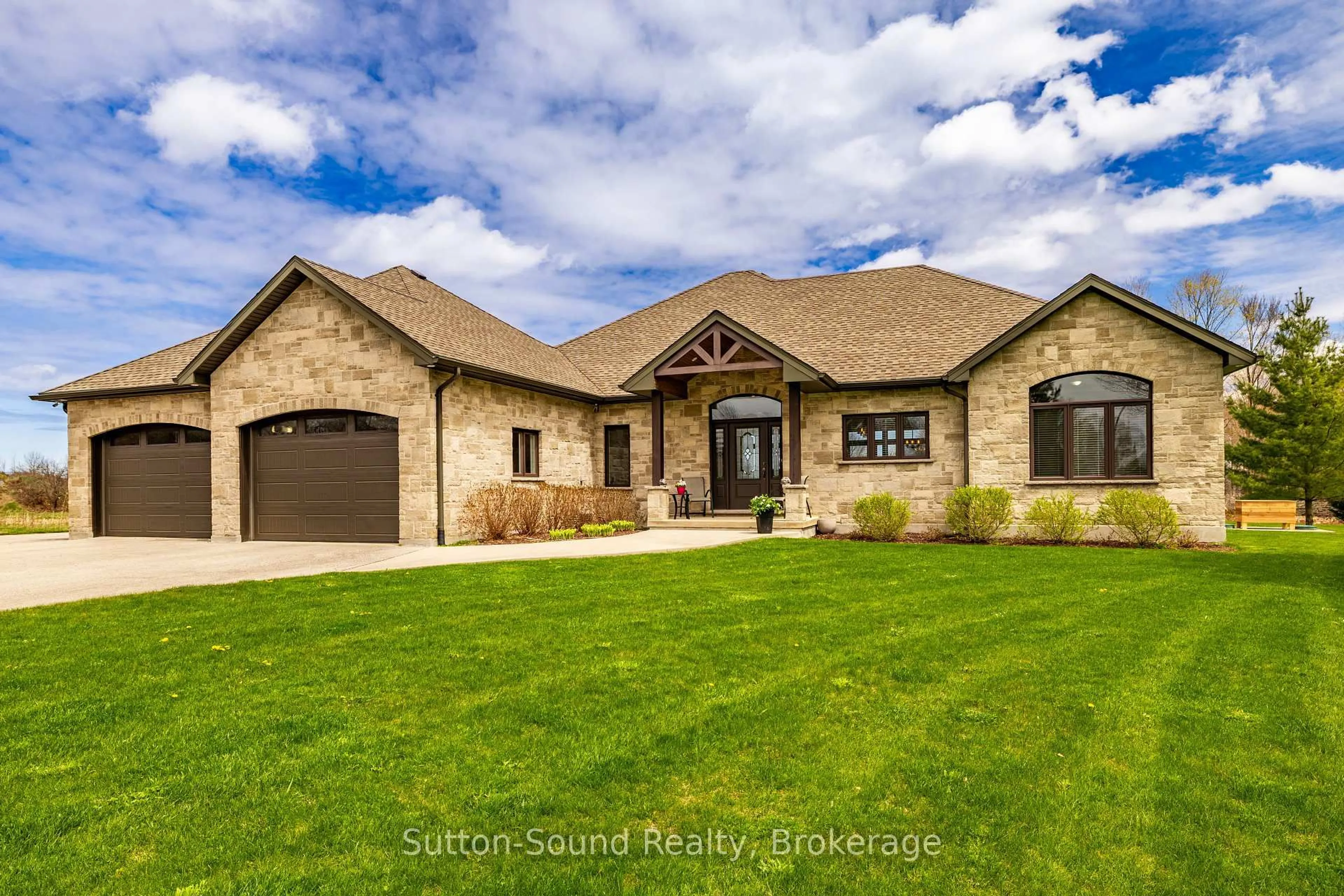 Home with brick exterior material, street for 318837 Grey Rd 1 Rd, Georgian Bluffs Ontario N4K 5N4