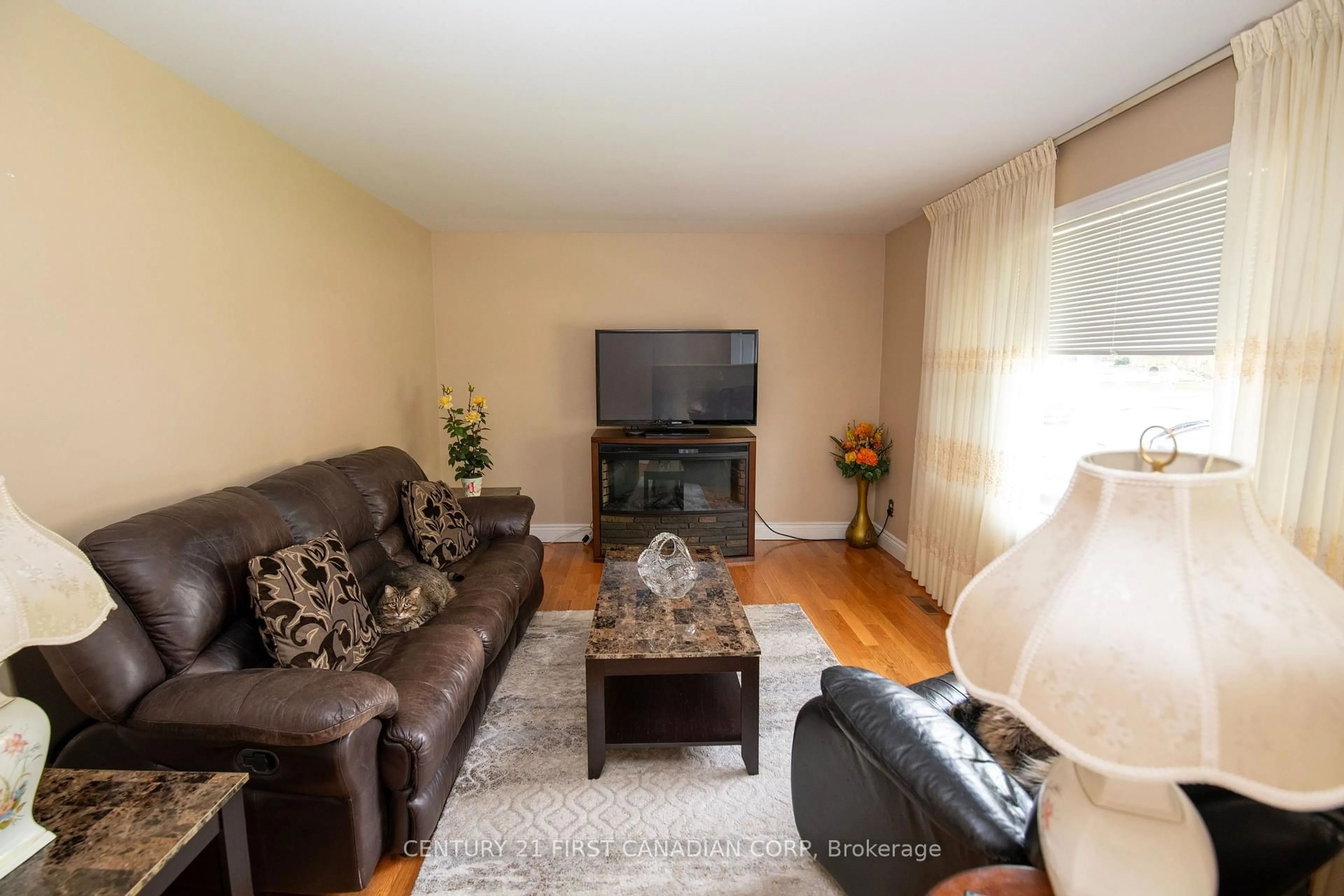 Living room with furniture, wood/laminate floor for 45 Manitoulin Dr, London East Ontario N5W 1M2