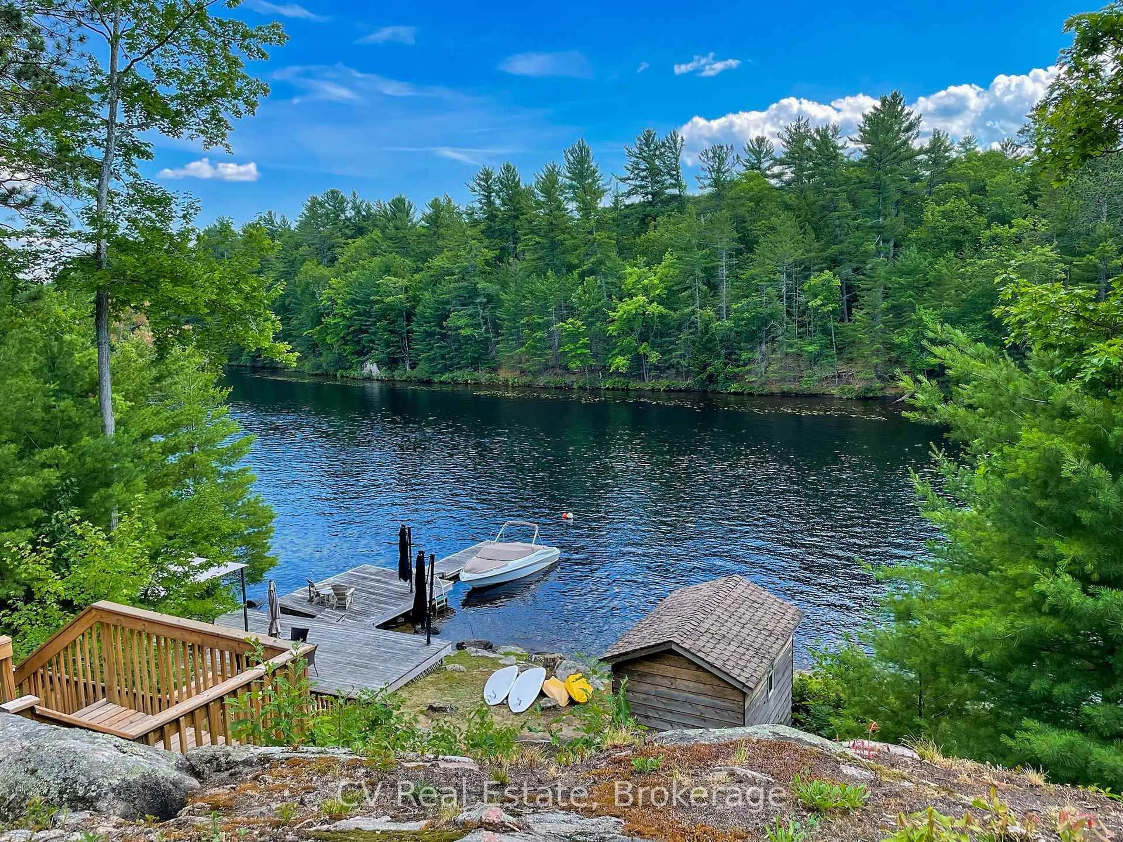 A pic from outside/outdoor area/front of a property/back of a property/a pic from drone, water/lake/river/ocean view for 1343 North Muldrew Lake Rd, Gravenhurst Ontario P1P 1V4