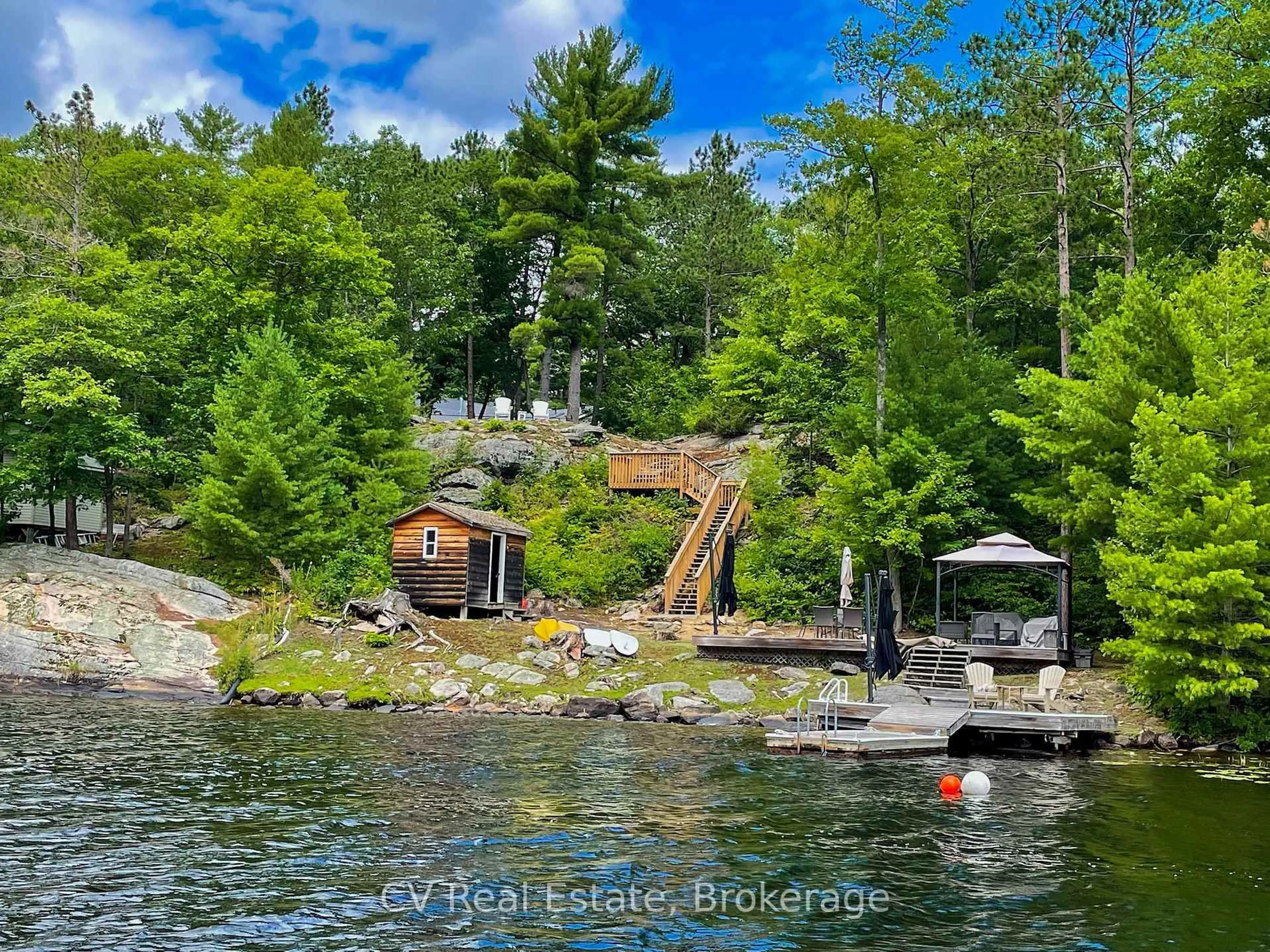 A pic from outside/outdoor area/front of a property/back of a property/a pic from drone, water/lake/river/ocean view for 1343 North Muldrew Lake Rd, Gravenhurst Ontario P1P 1V4